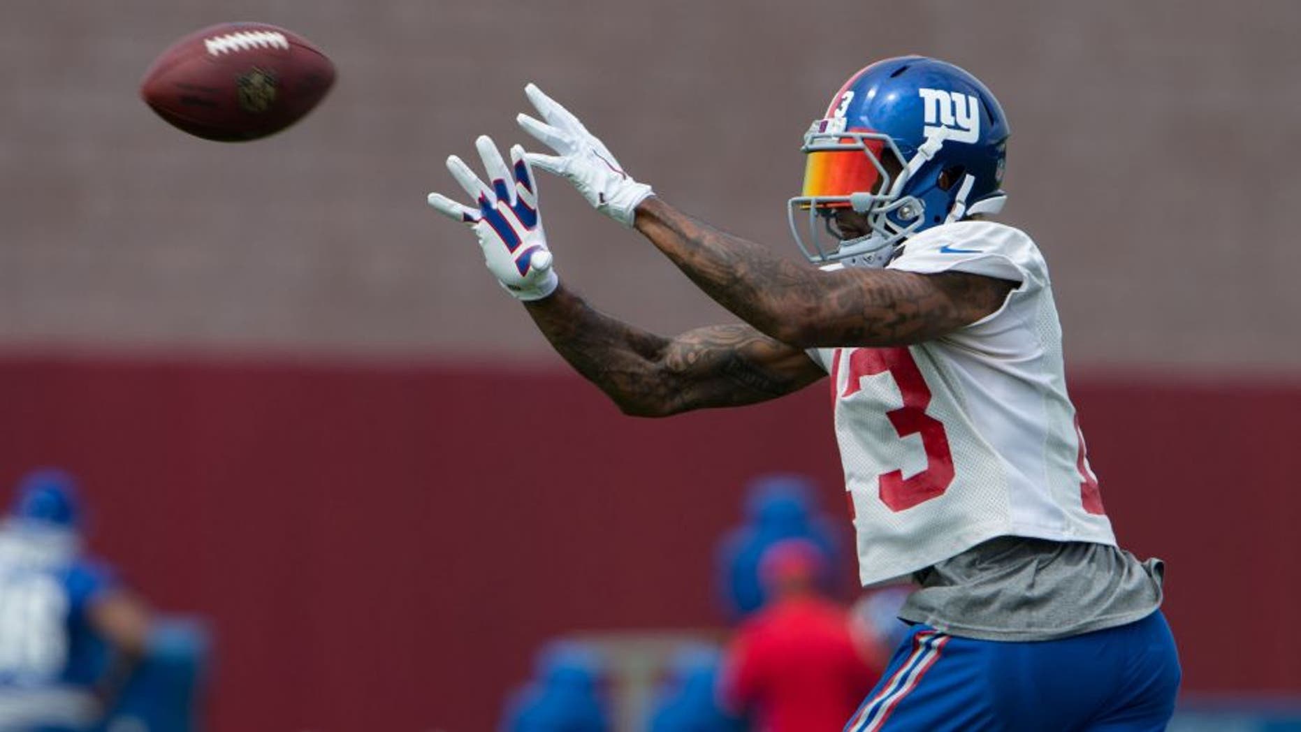Jul 30, 2016; East Rutherford, NJ, USA; New York Giants wide receiver Odell Beckham (13) catches the ball at Quest Diagnostics Training Center. Mandatory Credit: William Hauser-USA TODAY Sports