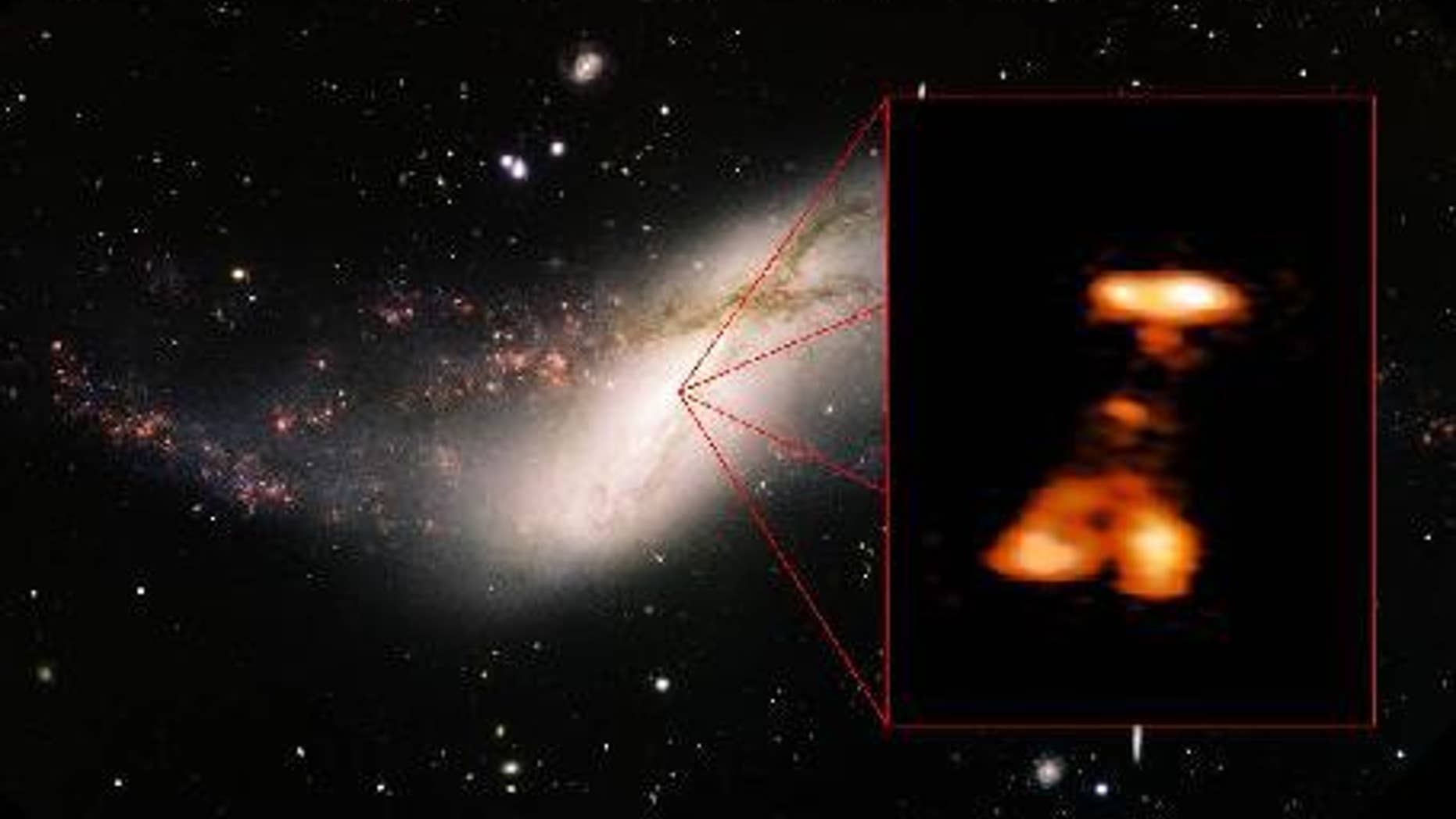 A massive outburst erupts from the giant black hole at the center of the distant galaxy NGC 660, which is 44 million light-years from Earth, in this via captured by ground-based telescopes. Image released Jan. 7, 2013.