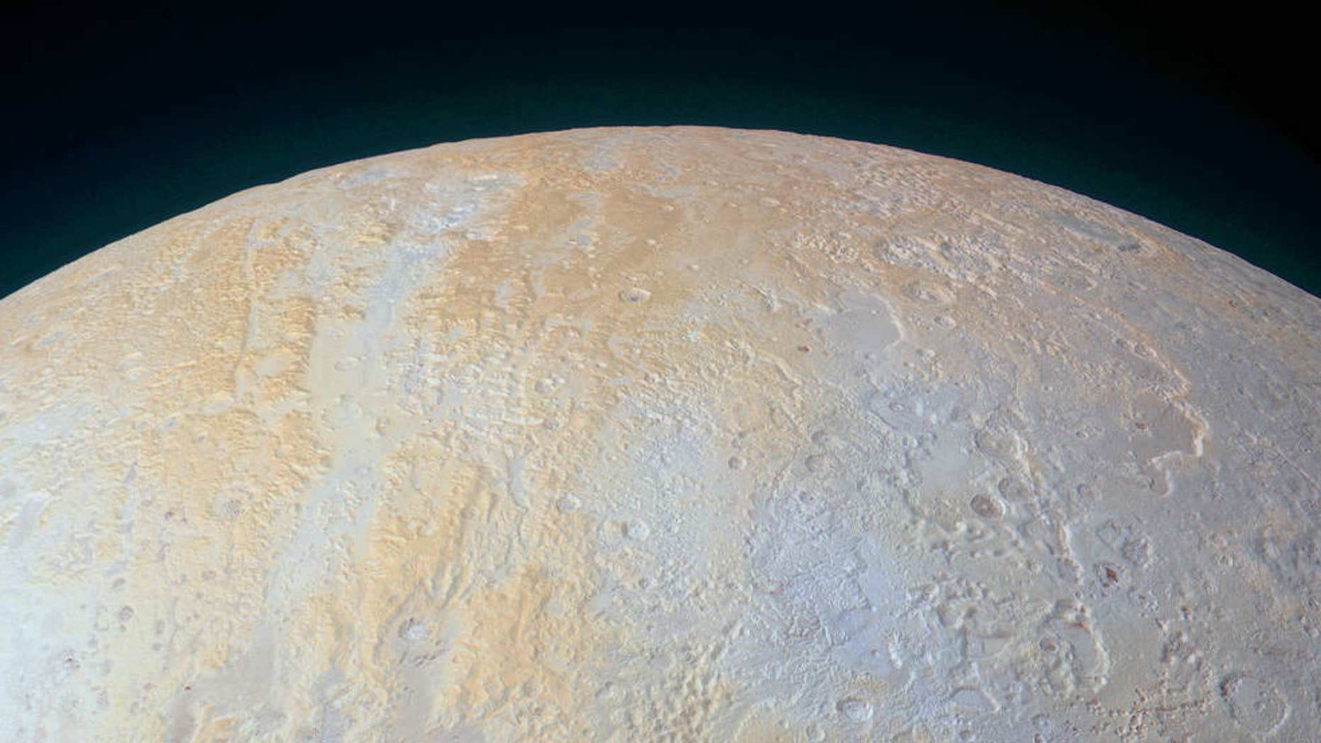 This ethereal scene captured by NASA’s New Horizons spacecraft tells yet another story of Pluto’s diversity of geological and compositional features—this time in an enhanced color image of the north polar area. (NASA)
