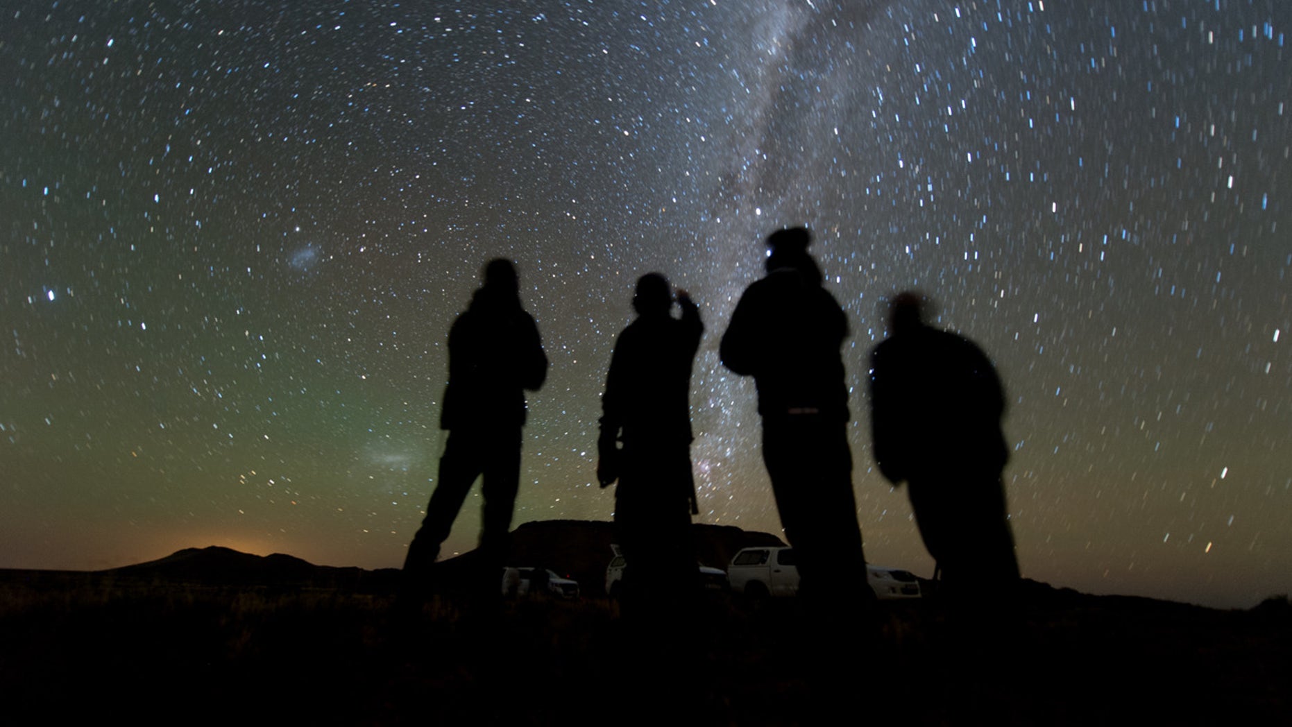 Four members of the New Horizons’ South African observation team scan the sky while waiting for the start of the 2014 MU69 occultation, early on the morning of June 3, 2017.