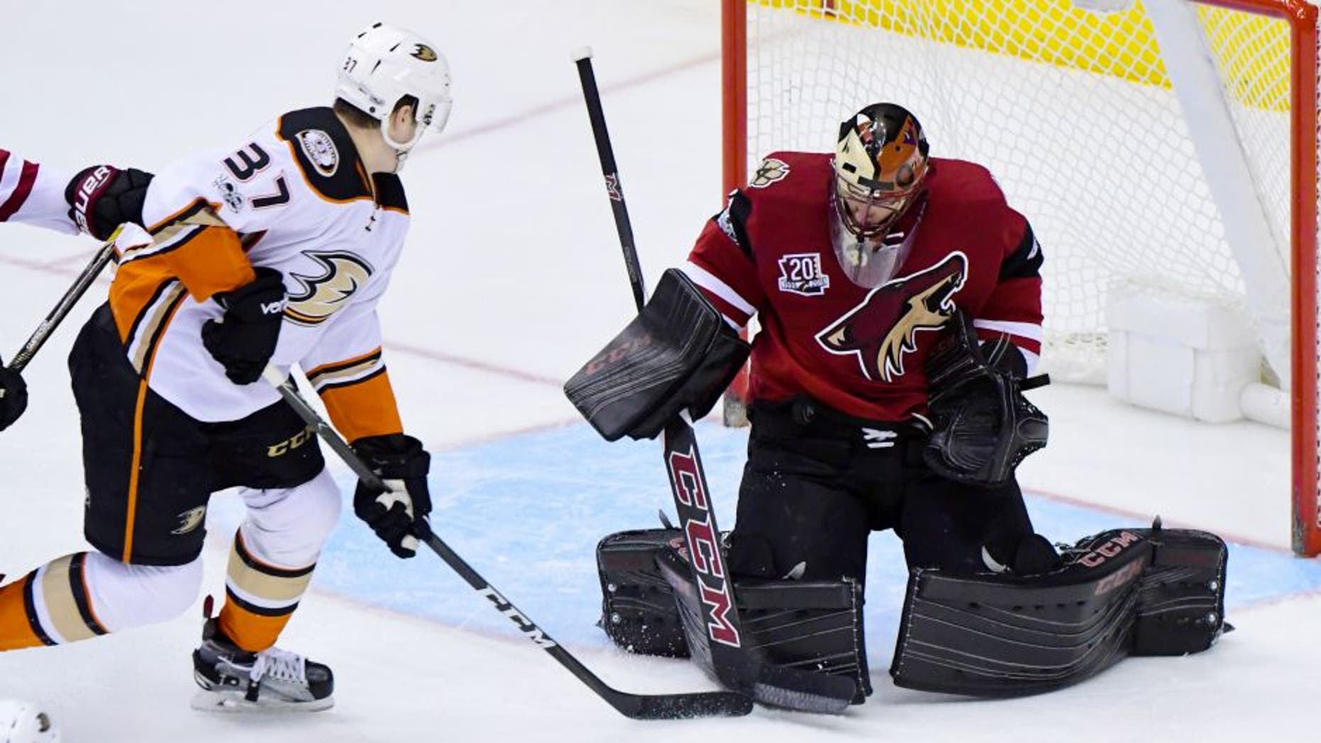 Feb 20, 2017; Glendale, AZ, USA; Arizona Coyotes goalie Mike Smith (41) makes a save against Anaheim Ducks left wing Nick Ritchie (37) during the second period at Gila River Arena. Mandatory Credit: Matt Kartozian-USA TODAY Sports