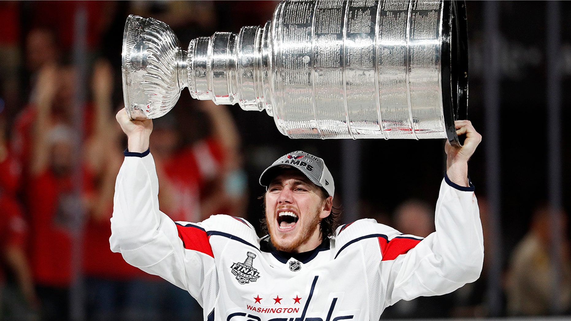 Washington Capitals right wing T.J. Oshie hoists the Stanley Cup after the Capitals defeated the Golden Knights 4-3 in Game 5 of the NHL hockey Stanley Cup Final.