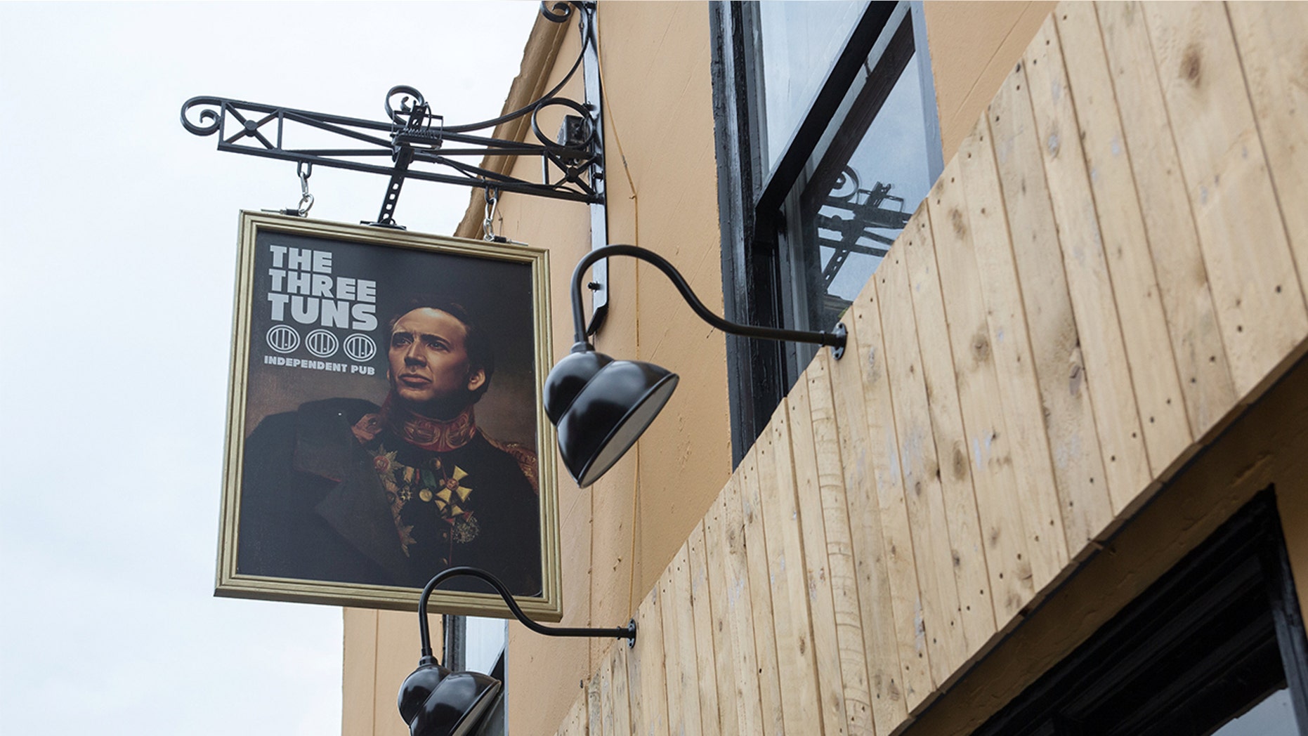 A Nicolas Cage-obsessed pub in England gave the actor a permanent home on their sign.
