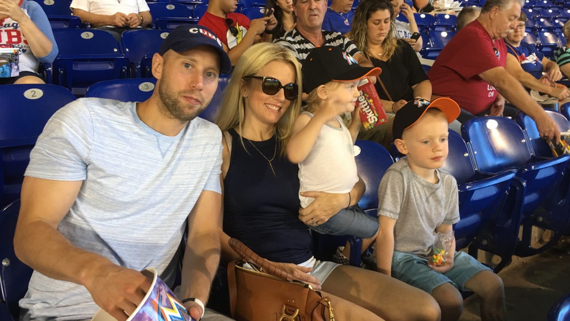 Nicholle Anderson is pictured with her husband, Craig, and two young sons.