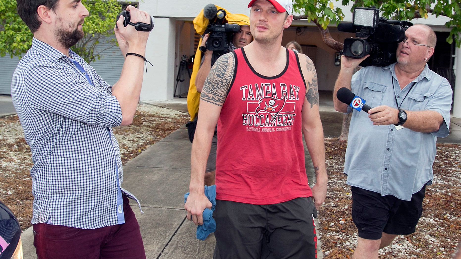 Singer Nick Carter is surrounded by media after being released on $1,500 bond from the Monroe County Detention Center in Key West, Fla., Jan. 14, 2016. Carter was charged with misdemeanor battery.(Rob O' Neal/Key West Citizen via AP)MIAMI HERALD OUT