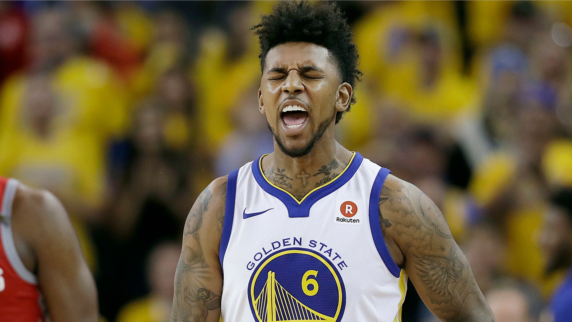 In this March 26, 2018 file photo, Golden State Warriors guard Nick Young (6) celebrates during Game 6 of the NBA basketball Western Conference Finals in Oakland, Calif.