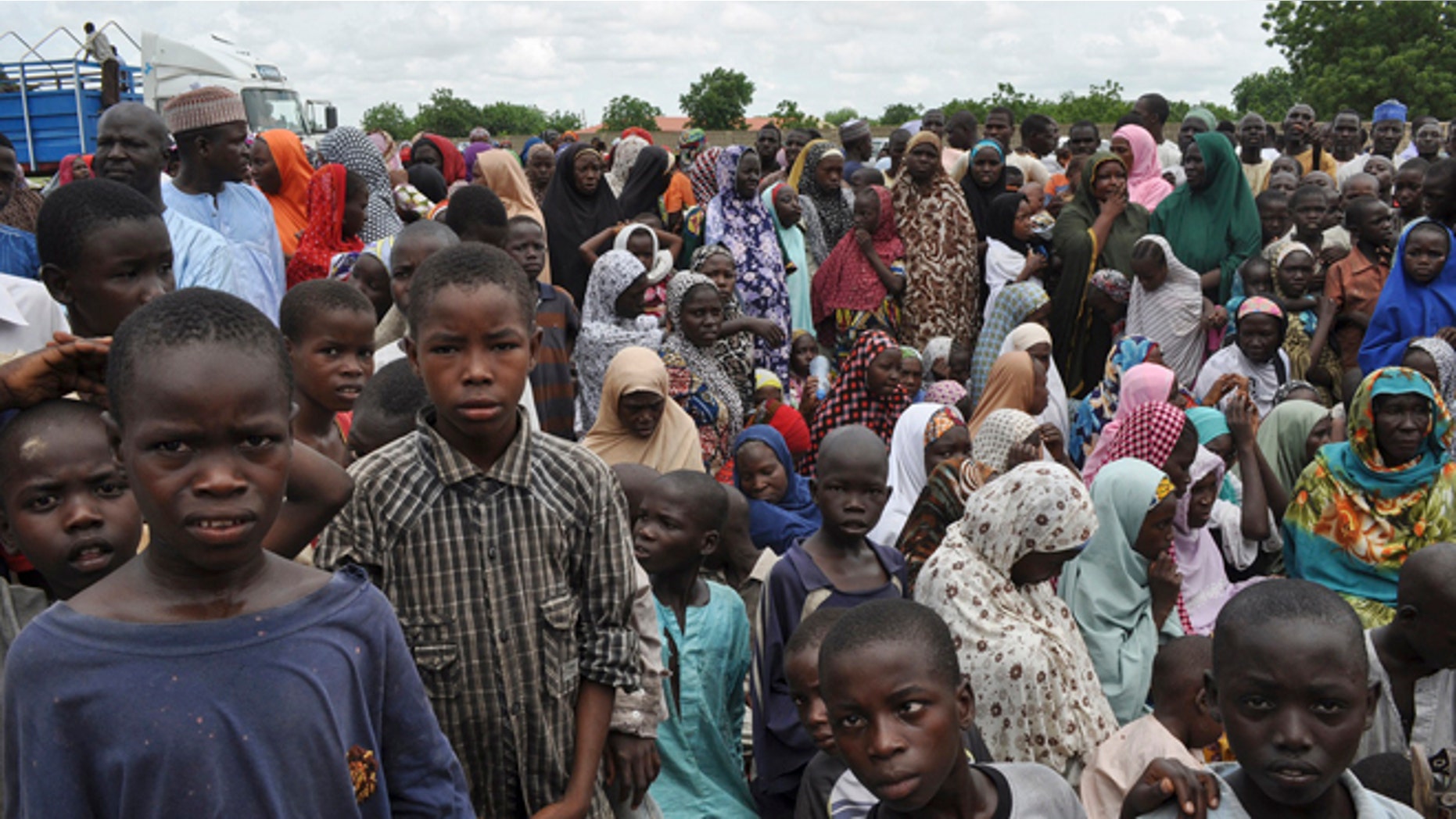 Sept. 9, 2014: Civilians who fled their homes following an attack by Islamist militants in Bama take refuge at a school in Maiduguri, Nigeria.