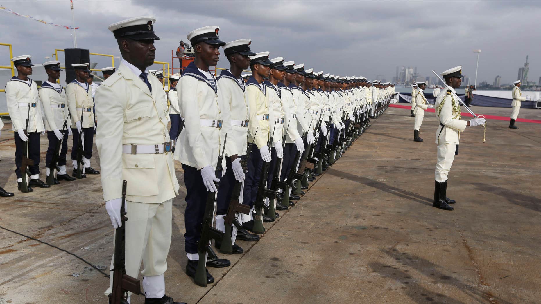 Feb. 19, 2015: Nigerian naval officers stand guard during an event to commission Warships by Nigerian President Goodluck Jonathan.