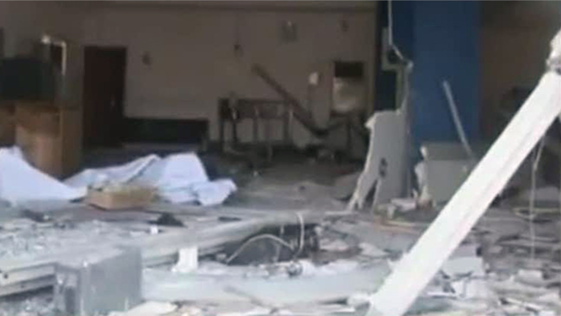Nov. 6, 2011: In this image made from television released by the state-run Nigerian Television Authority, a damaged building is seen in Damatura, Nigeria, following a series of coordinated attacks Friday that killed at least 100 people and left a new police headquarters in ruins, government offices burned and symbols of state power destroyed.