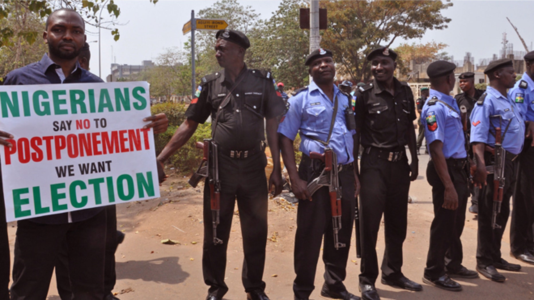 Feb. 7, 2015: Nigerian Police provide security in Abuja, Nigeria as people demonstrate against the possible postponement of the Nigerian elections. (AP)