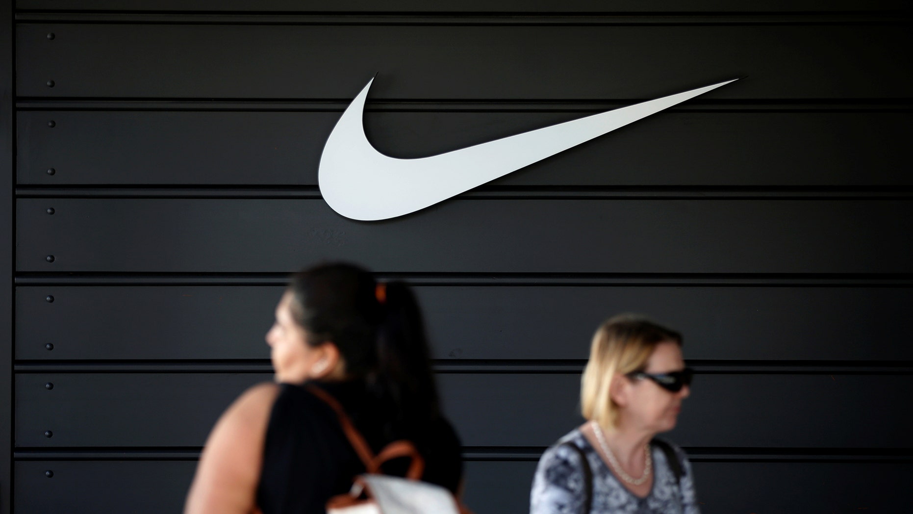The logo of Dow Jones Industrial Average stock market index listed company Nike (NKE) is seen in Los Angeles, California, United States, April 12, 2016