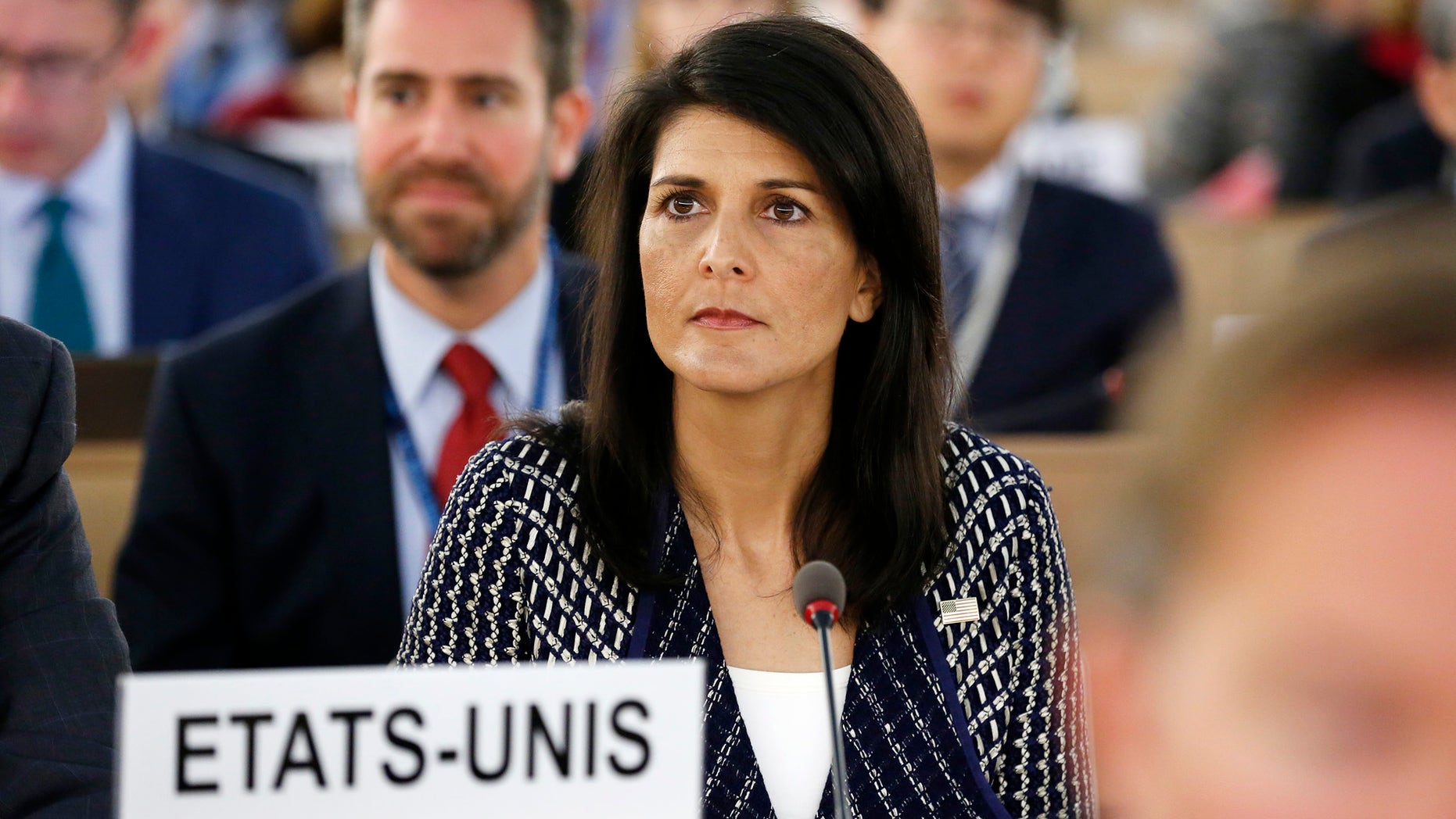 United States permanent Representative to the United Nations Ambassador Nikki Haley waits before delivering a speech about the current humanitarian situation in the world, during the opening of the 35th session of the Human Rights Council, at the European headquarters of the United Nations in Geneva, Switzerland, Tuesday, June 6, 2017. (Magali Girardin/Keystone via AP)