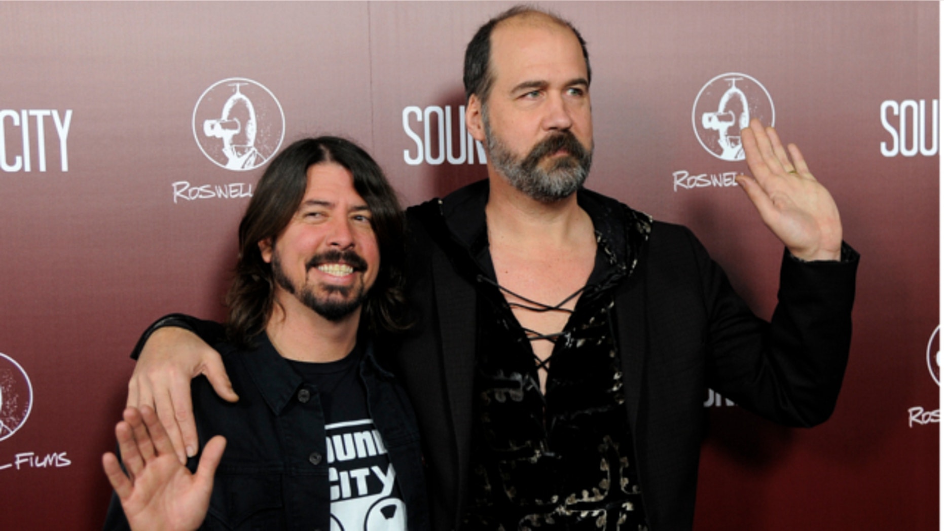 Jan. 31, 2013: Dave Grohl, left, poses with Nirvana bandmate Krist Novoselic at the premiere of the documentary film "Sound City," in Los Angeles.