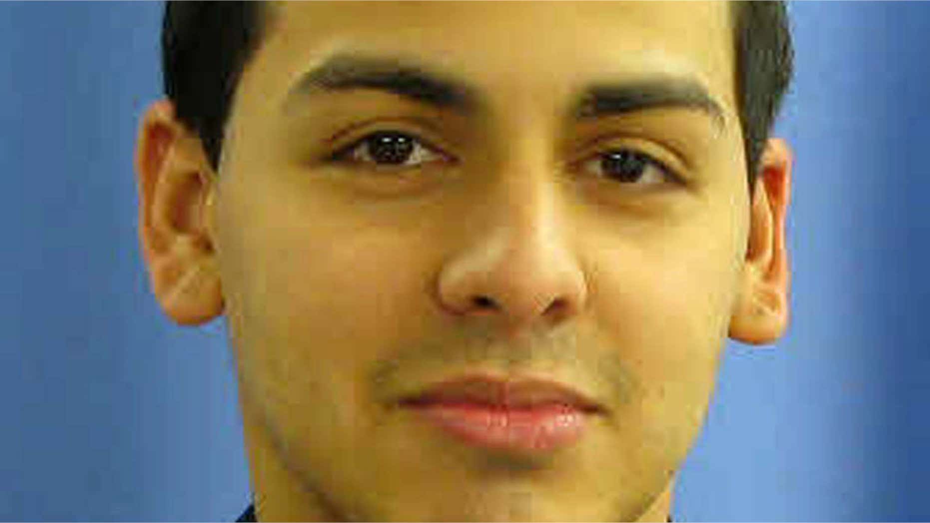 In this undated photo provided by the Linden, N.J. Police Department, Police Officer Pedro Abad is shown. Abad, 27, is in critical condition after the car he was driving struck a truck head-on, while travelling in the wrong direction on a Staten Island N.Y., highway