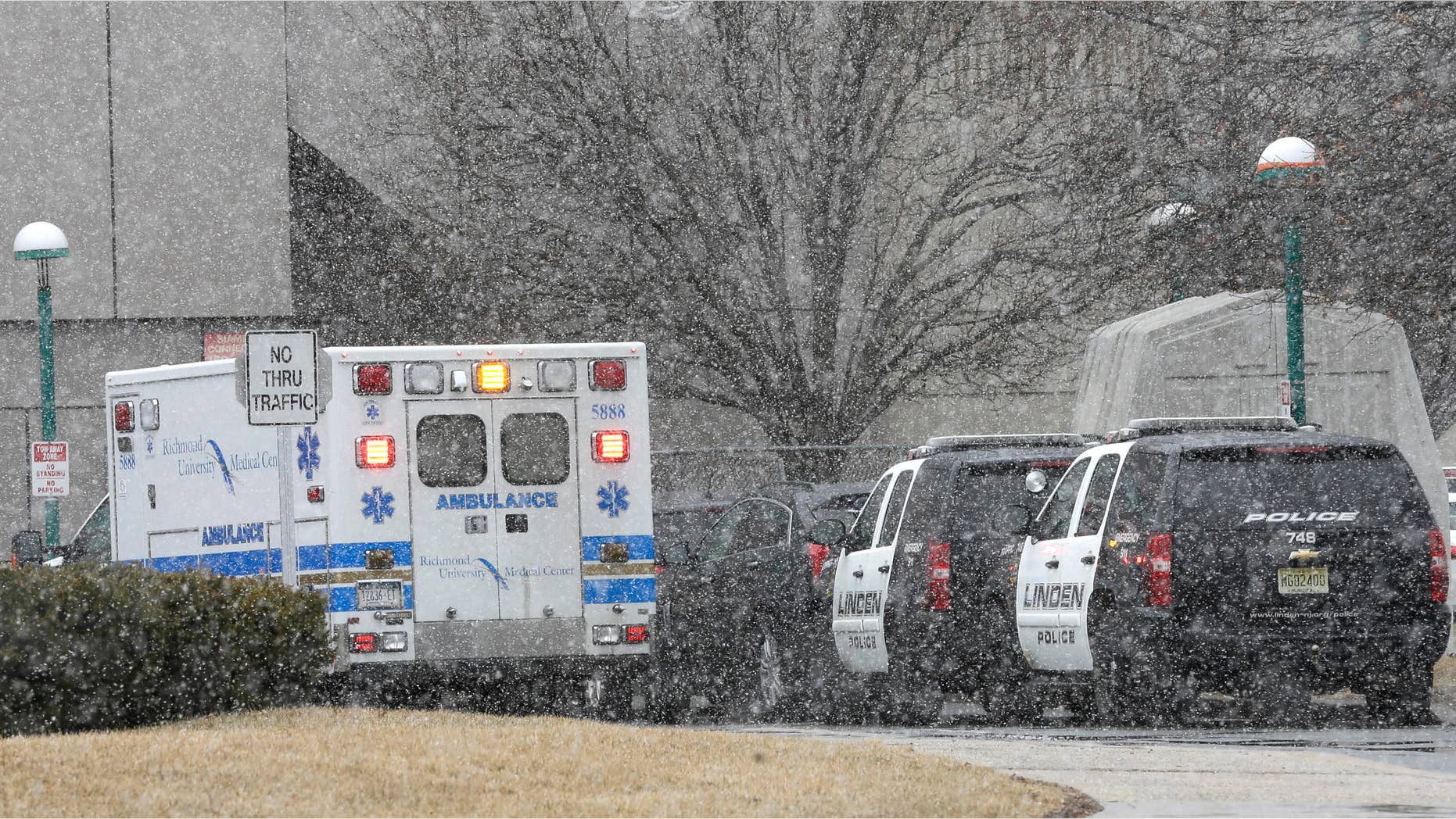 March 20, 2015: Linden, N.J. police department cars are parked near the emergency room exit of the Staten Island University Medical Center.