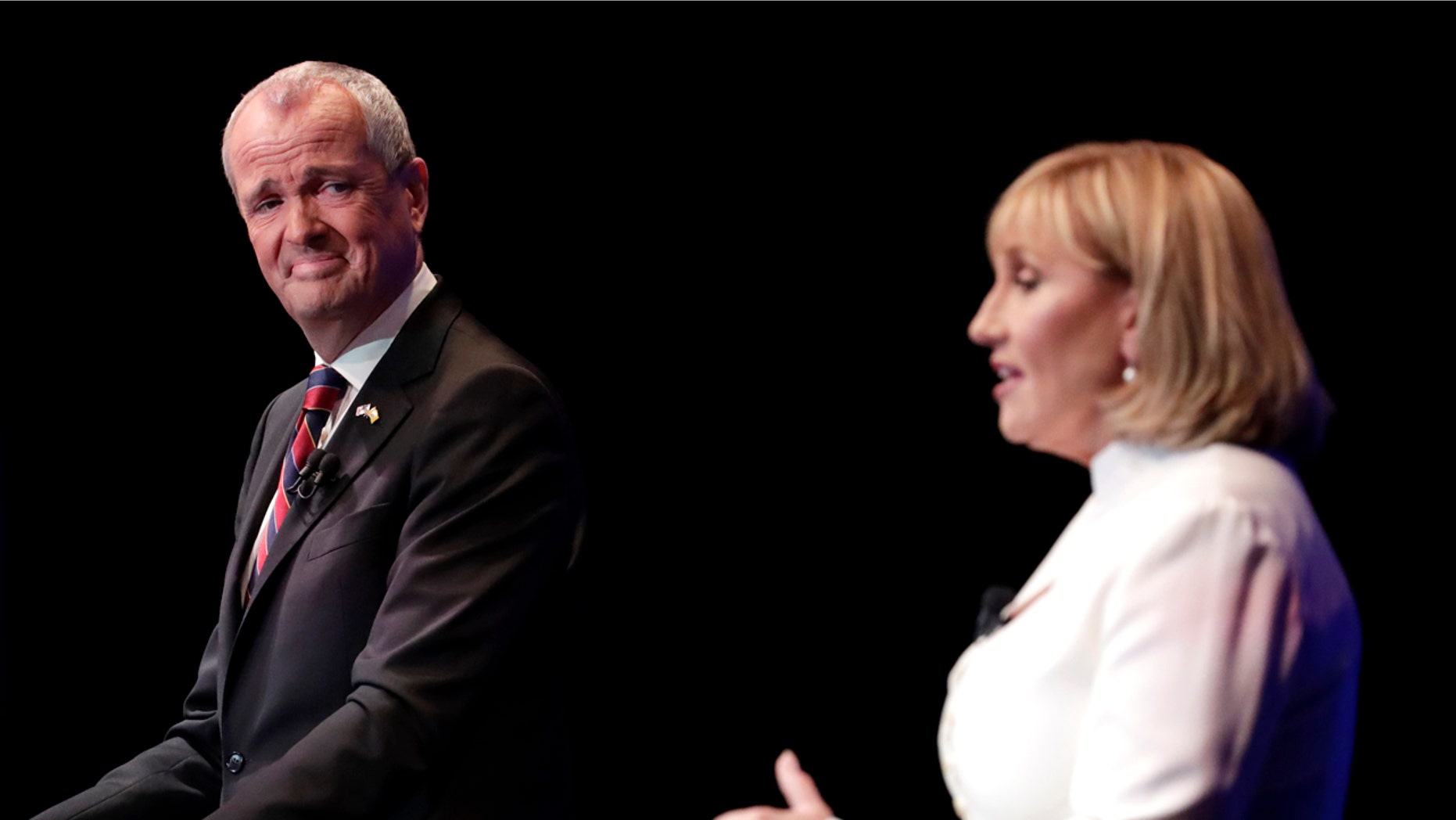 New Jersey gubernatorial candidates Phil Murphy, a Democrat, and Kim Guadagno, a Republican, are seen during their first debate, Oct. 10, 2017.