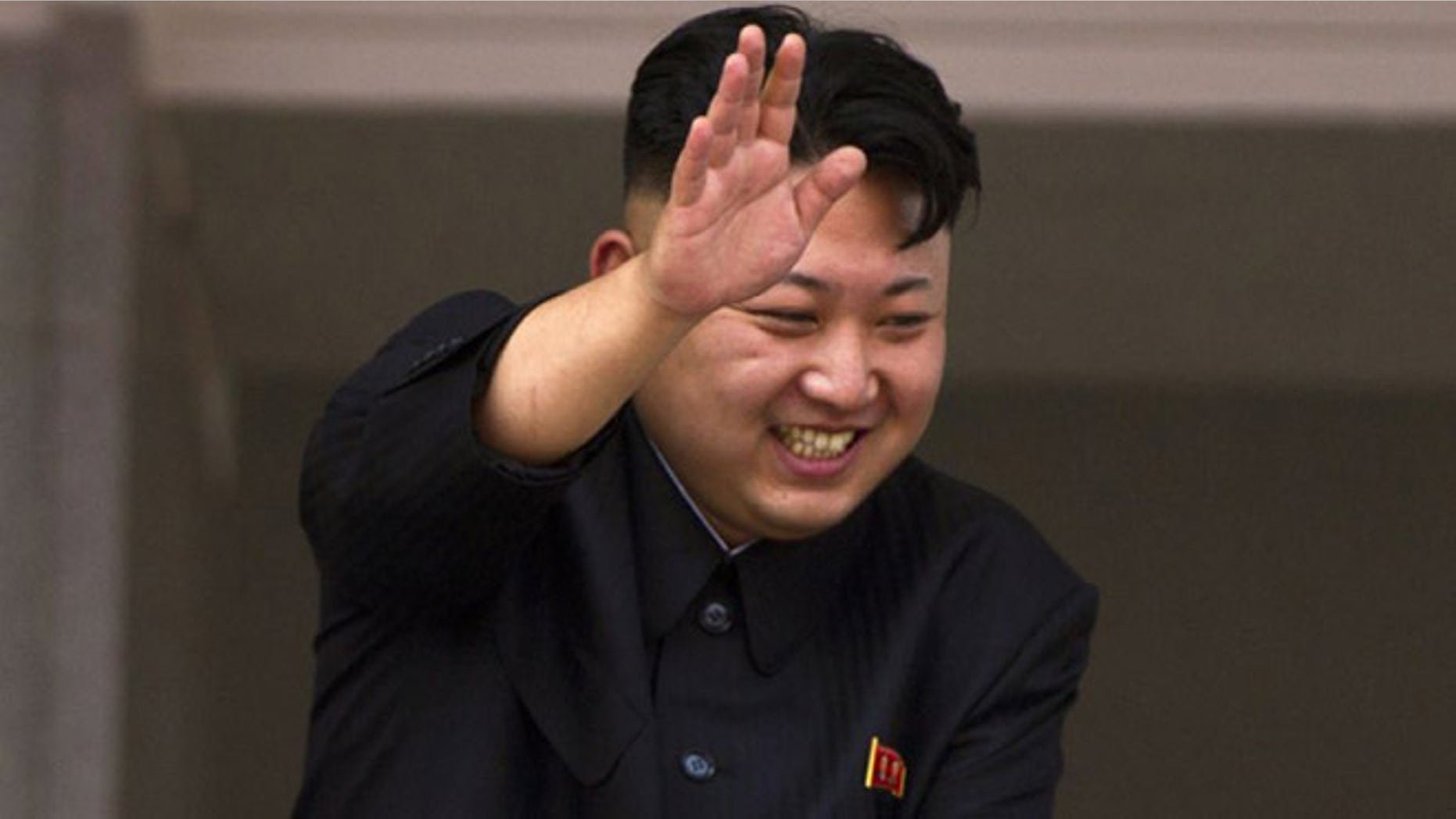 July 27, 2013: In this file photo, North Korean leader Kim Jong Un leans over a balcony and waves to Korean War veterans cheering below at the end of a mass military parade on Kim Il Sung Square in Pyongyang to mark the 60th anniversary of the Korean War armistice.