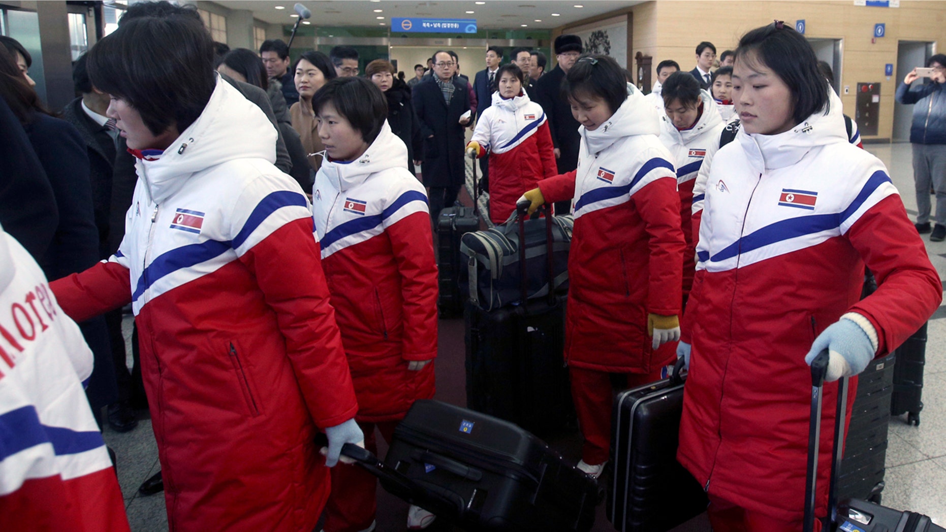 North Korean women's hockey players arrive at the Inter-Korean Transit Office in Paju, South Korea, Thursday.