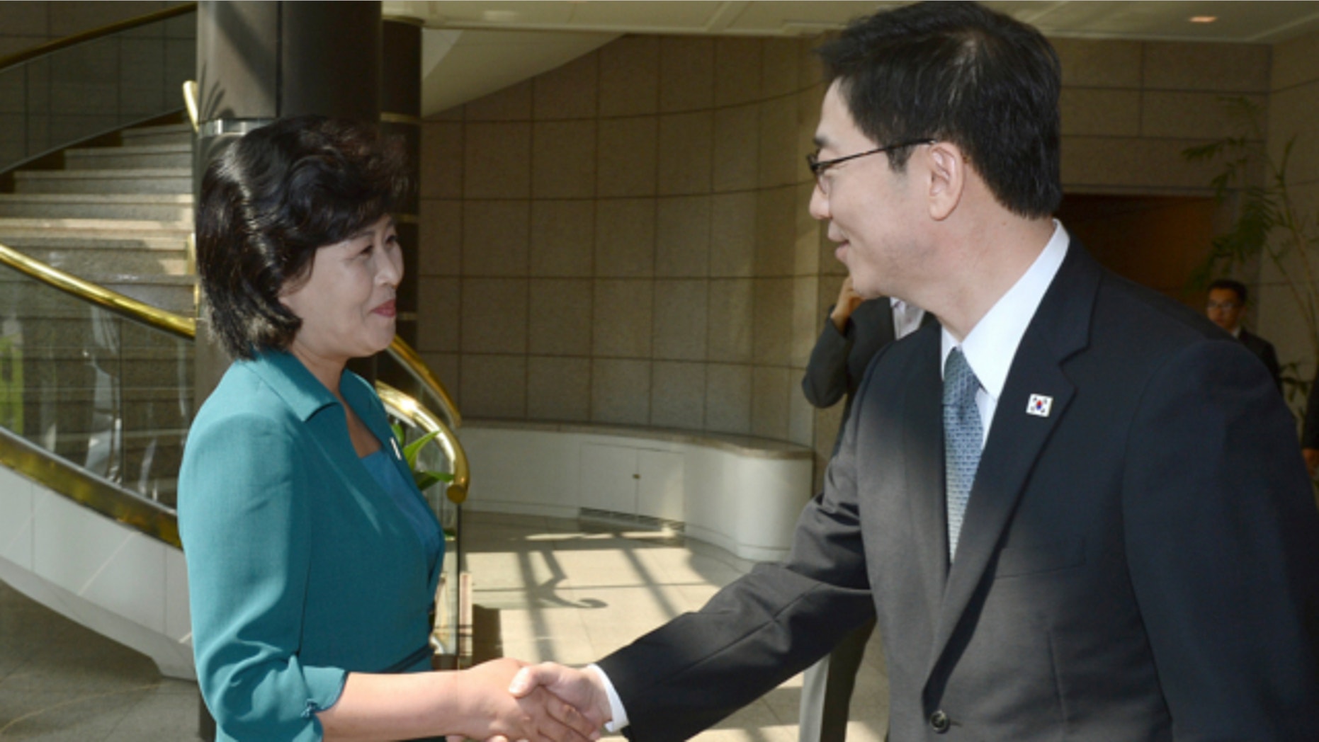 June 9, 2013: In this photo released by the South Korean Unification Ministry, South Korea's Unification Policy Officer Chun Hae-sung, right, shakes hands with the head of North Korea's delegation Kim Song Hye, left, upon Kim's arrival to their meeting at the southern side of Panmunjom, which has separated the two Koreas since the Korean War, in Paju, north of Seoul, South Korea.