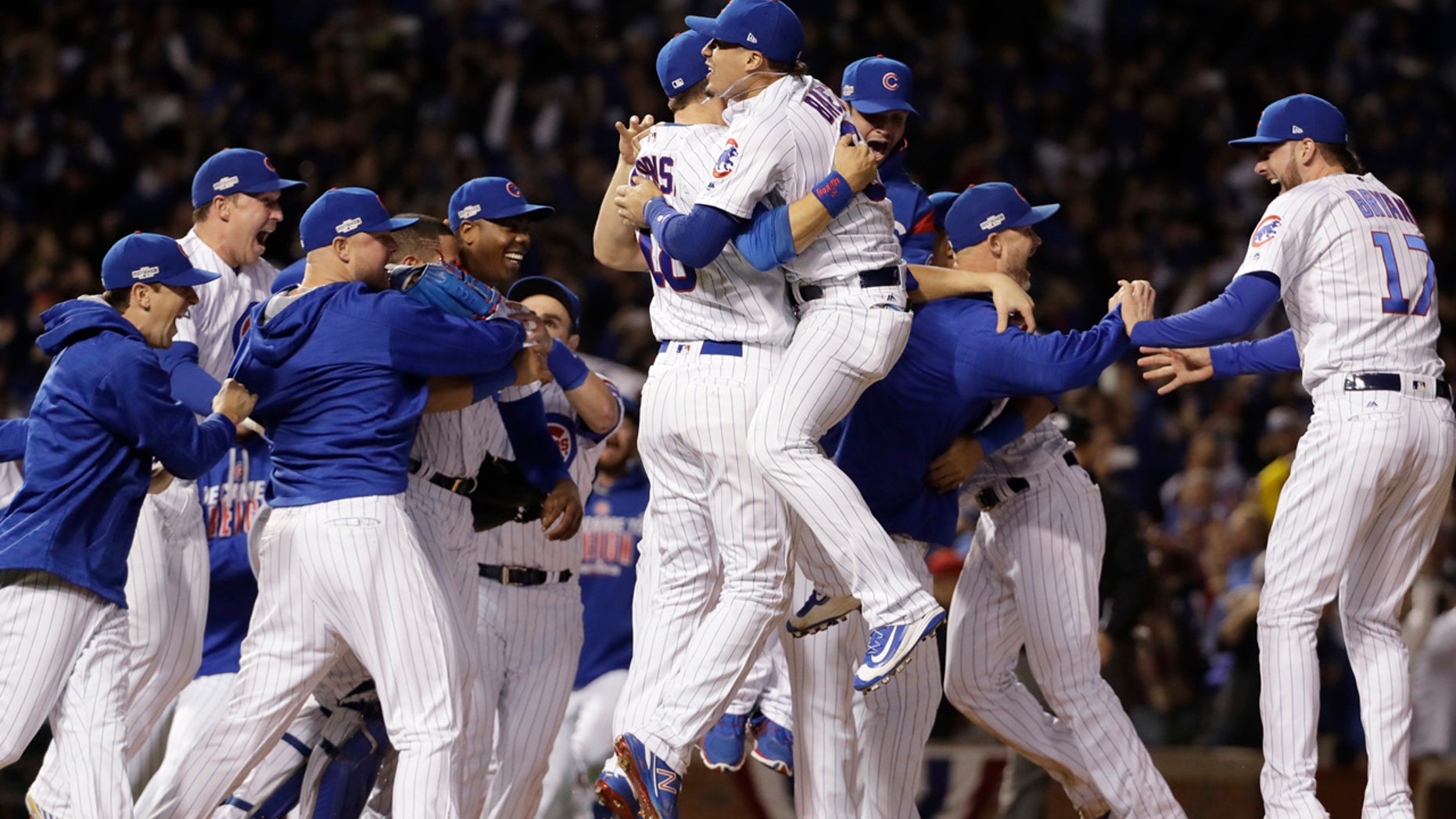 Chicago Cubs players celebrate after Game 6 of the National League baseball championship series against the Los Angeles Dodgers, Saturday, Oct. 22, 2016, in Chicago.