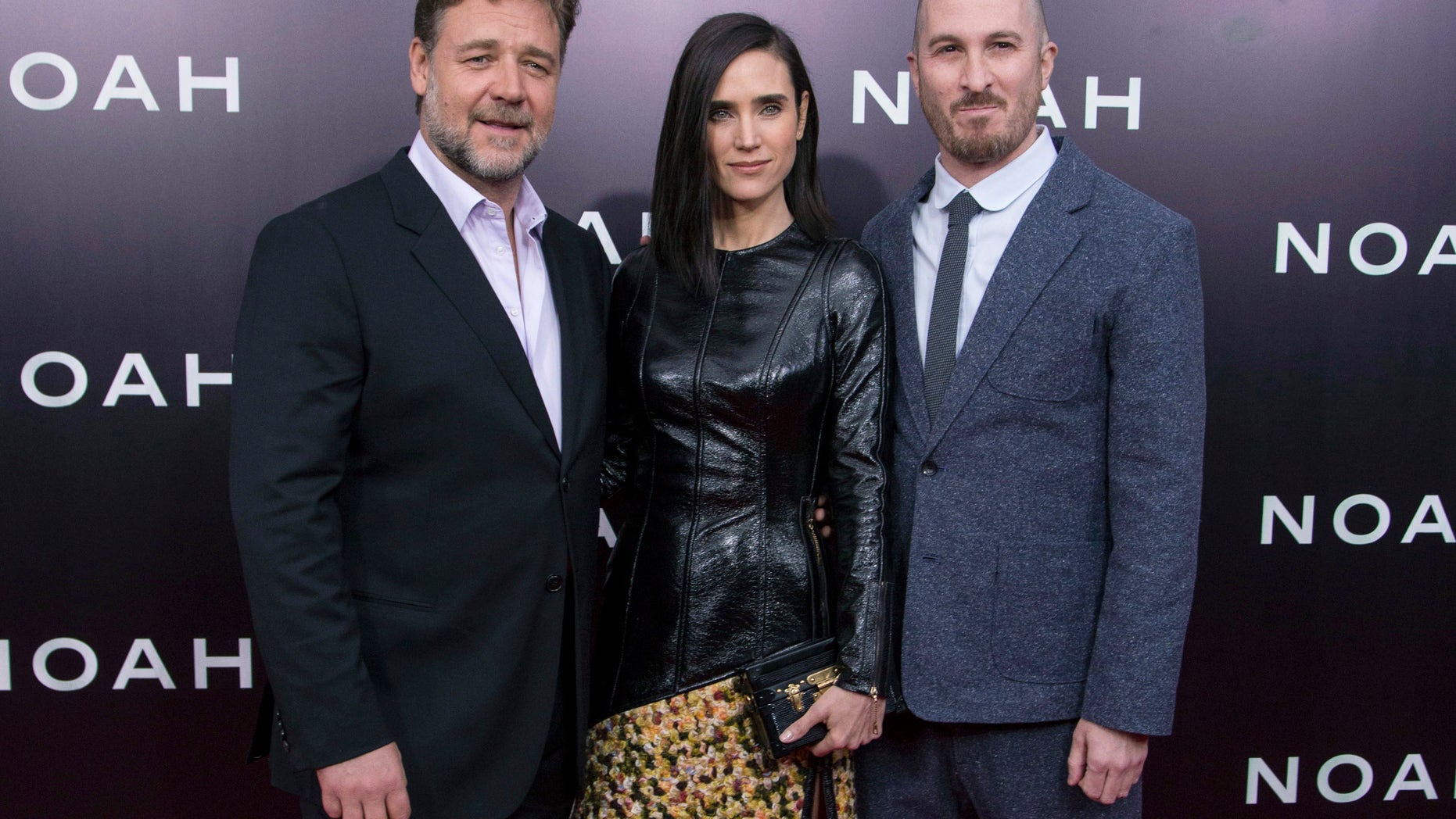 March 26, 2014. (L-R) Cast members Russell Crowe and Jennifer Connelly pose with director Darren Aronofsky during the U.S. premiere of "Noah" in New York.