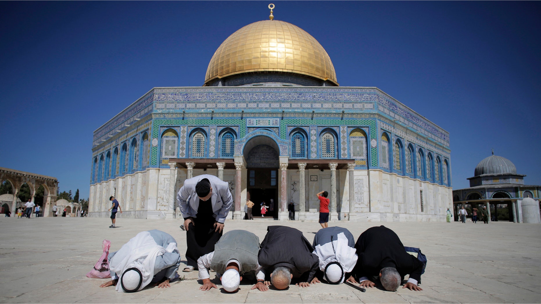 Oct. 5, 2014: Palestinians from Gaza pray in front of the Dome of the Rock during their visit at the compound known to Muslims as Noble Sanctuary and to Jews as Temple Mount in Jerusalem's Old City.