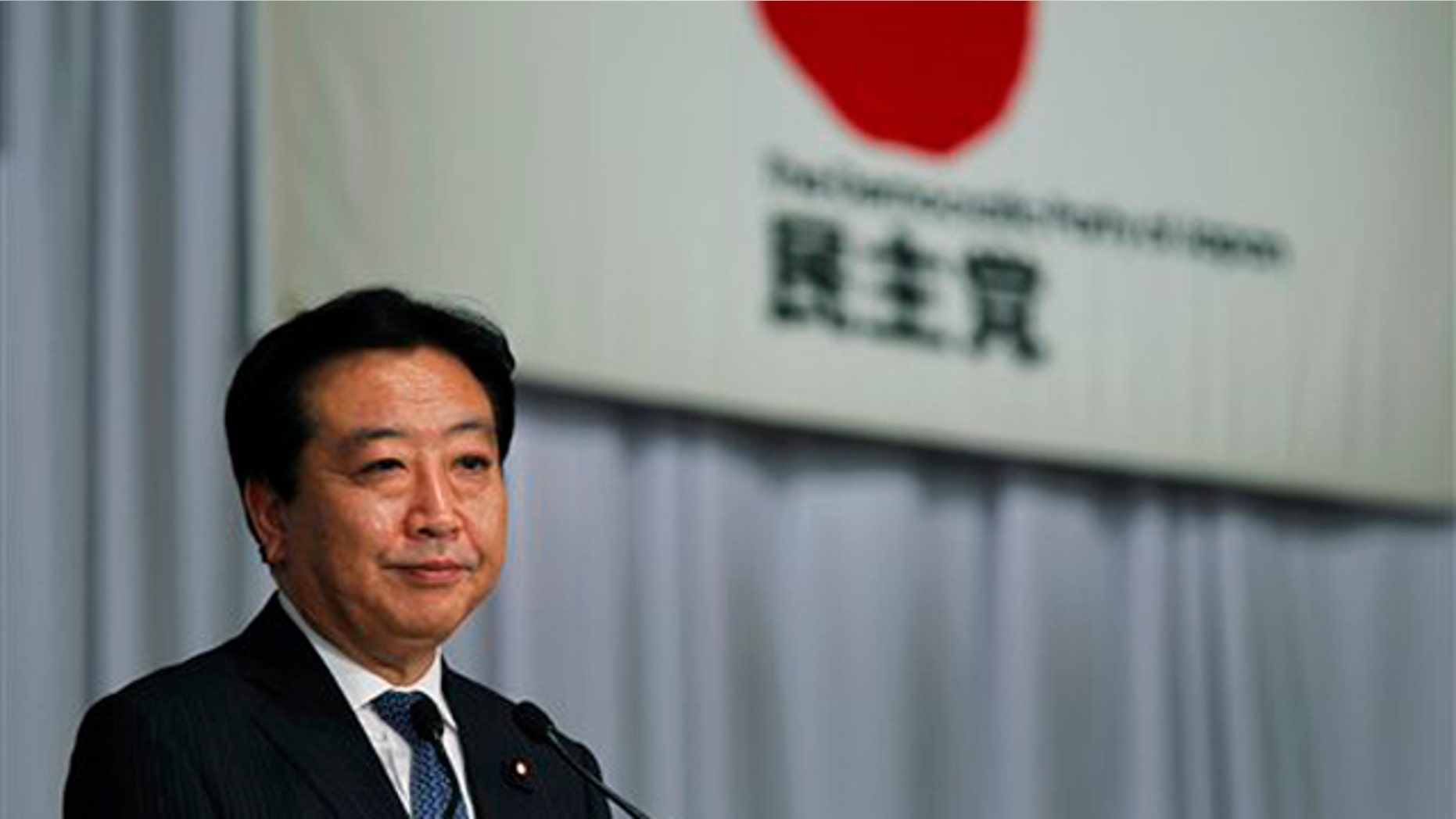 New leader of the Democratic Party of Japan Yoshihiko Noda speaks during a press conference shortly after his election at a voting by the party lawmakers in Tokyo Monday, Aug. 29, 2011.