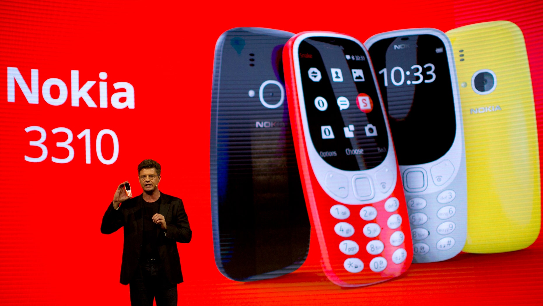 Arto Nummela, Chief Executive Officer at HMD Global, shows the new re-launched Nokia 3310 phone, ahead of Monday's opening of the Mobile World Congress wireless show in Barcelona, Spain, Sunday, Feb. 26, 2017. (AP Photo/Emilio Morenatti)