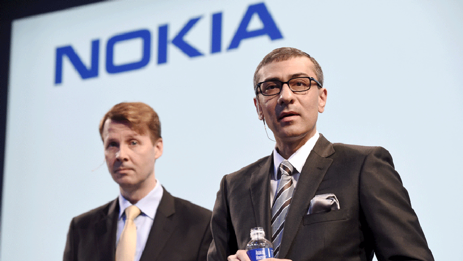 Nokia's chairman Risto Siilasmaa (L) and Chief Executive Rajeev Suri during the press conference held in Nokia head offices in Espoo, Finland 17th April 2015.