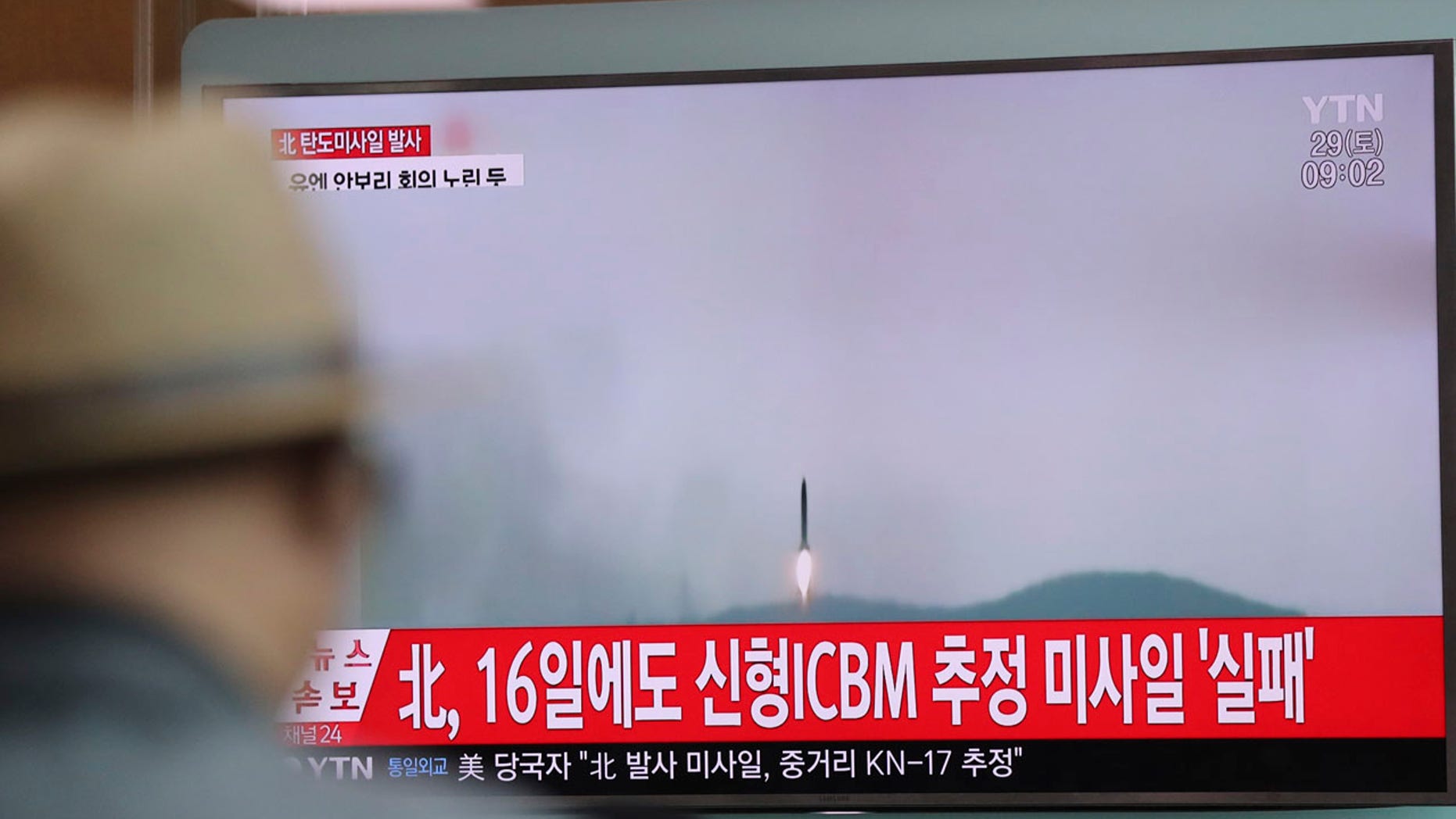 A man watches a TV news program reporting about North Korea's missile firing with a file footage, at Seoul Train Station in Seoul, South Korea, Saturday, April 29, 2017.