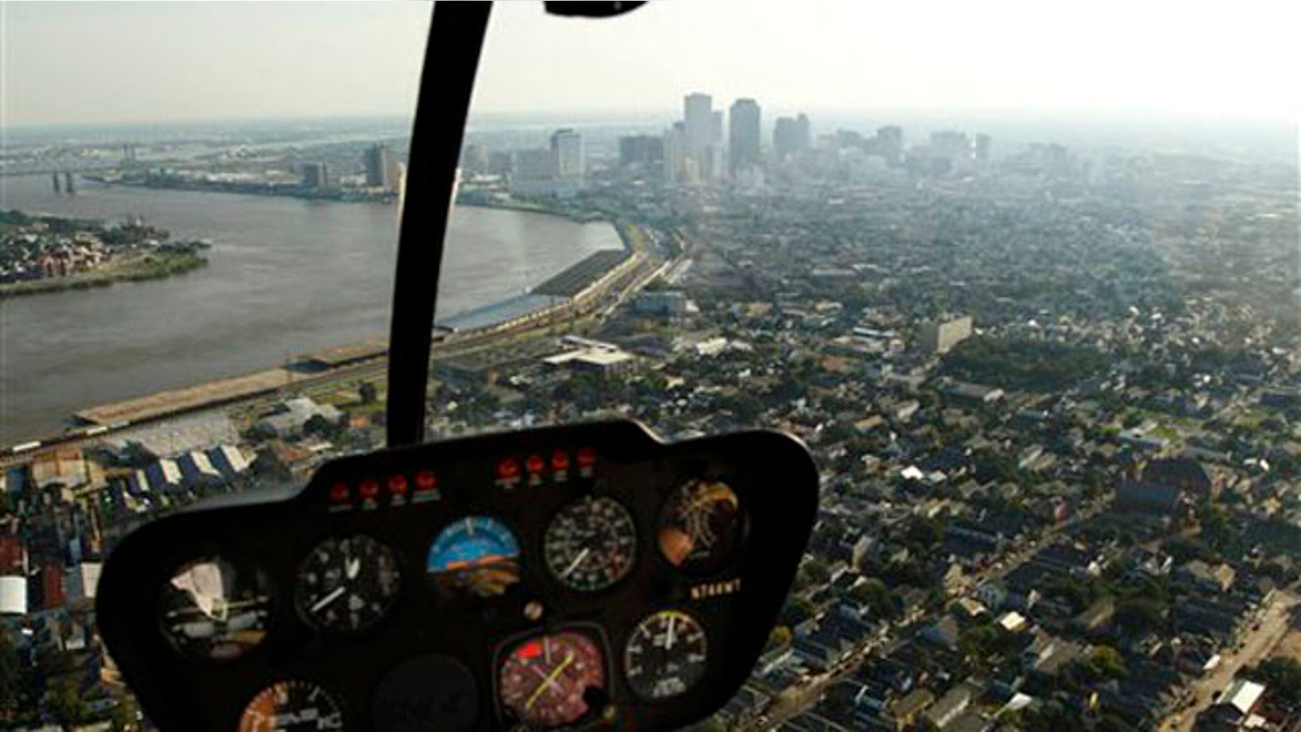 In this July 31, 2010 photo, the New Orleans skyline is seen from the cockpit of a helicopter.