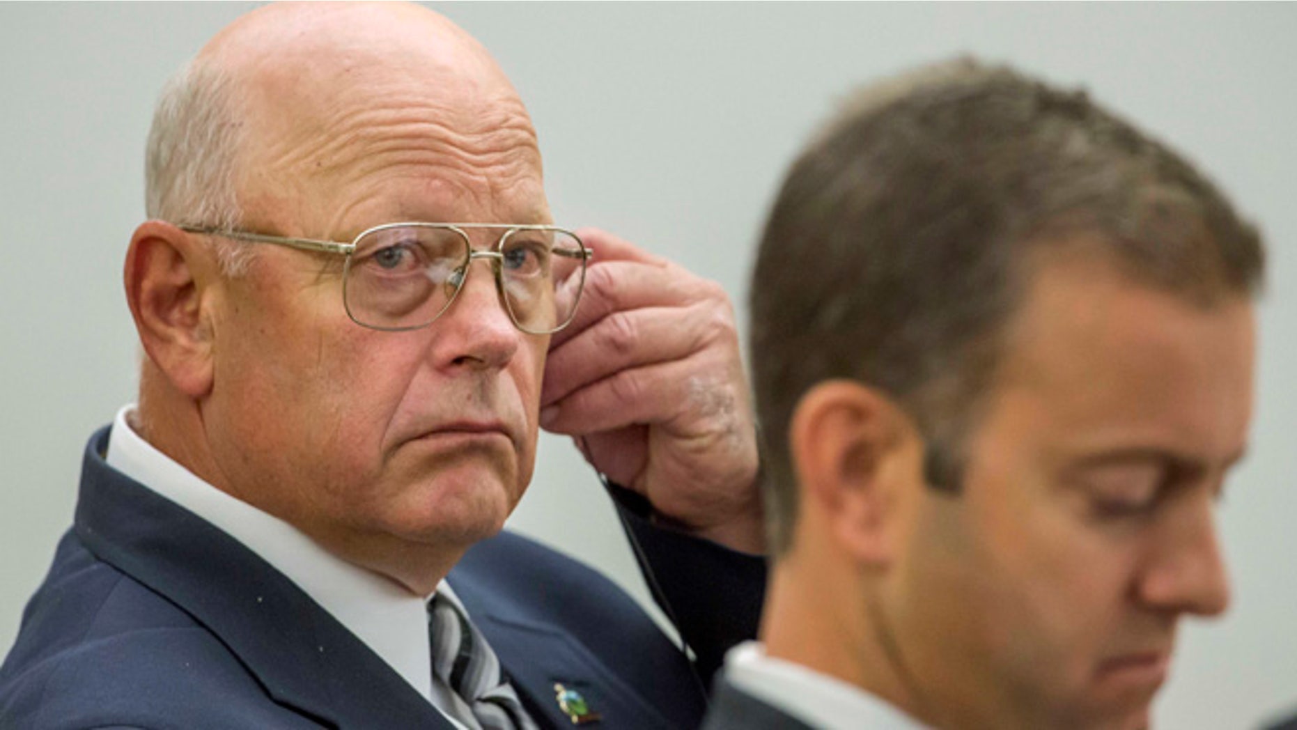 June 15, 2016: Vermont state Sen. Norman McAllister, left, sits in court with his defense attorney Brooks McArthur. (AP)