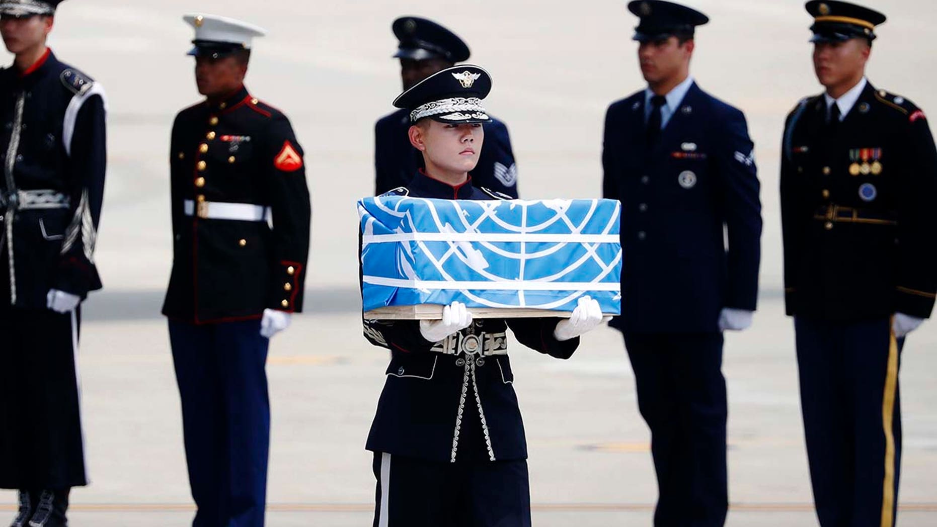 A soldier carries a casket containing what was believed to be the remains of a U.S. soldier who was killed in the Korean War, during a ceremony at Osan Air Base in Pyeongtaek, South Korea, July 27, 2018.