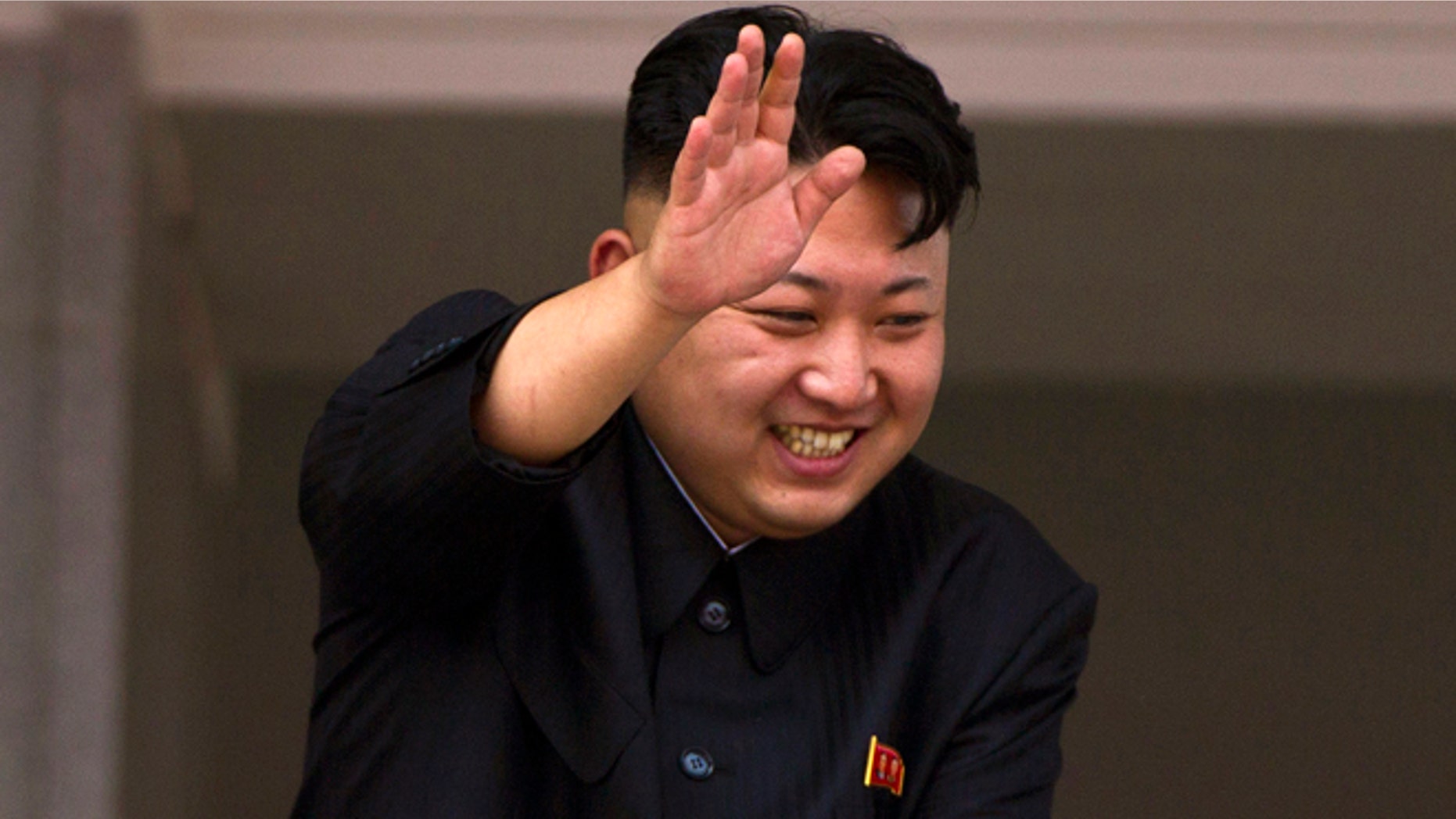 July 27, 2013: In this file photo, North Korean leader Kim Jong Un leans over a balcony and waves to Korean War veterans cheering below at the end of a mass military parade on Kim Il Sung Square in Pyongyang to mark the 60th anniversary of the Korean War armistice.