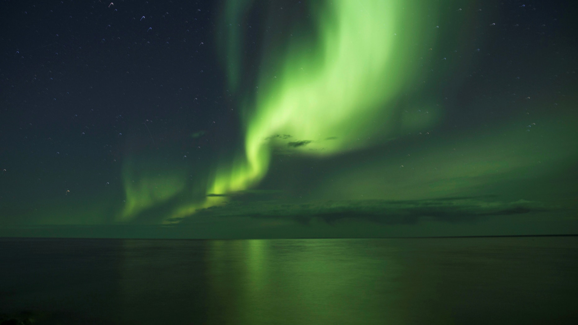 Northern lights are caused by "collisions between fast-moving particles (electrons) from space" an Earth's atmosphere.