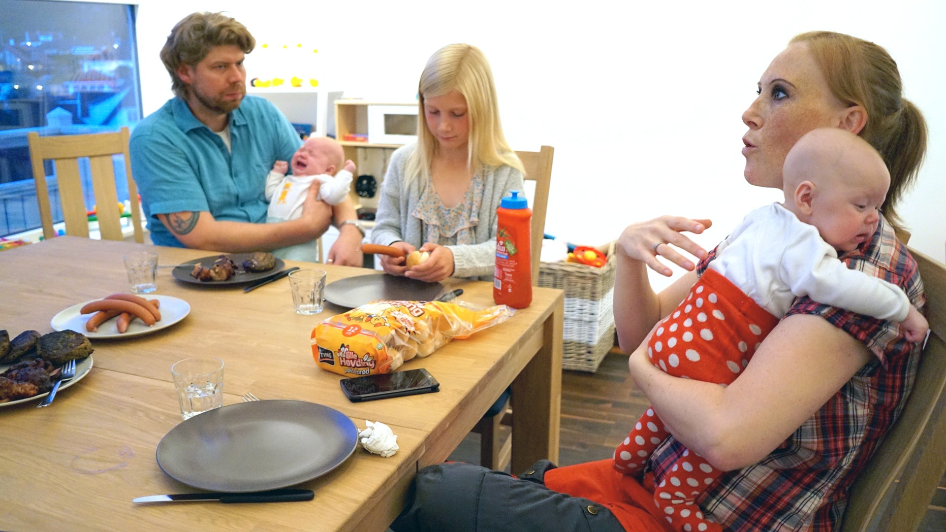 In this photo taken on Sunday, Sept. 11, 2016, 10 year-old Anna Thulin sits down for dinner with her mother Siri Oline Myge and stepfather Ola Vassbo in Haugesund, Norway. Anna was born a boy but never felt like one. Soon, she is likely to receive a letter confirming that she is legally a girl. Norway recently became the fifth country in the world to allow adults to legally change genders without a doctorâs agreement or intervention. Argentina, Ireland and Denmark have similar laws. But only Malta and Norway have extended the liberalized rules to children. (AP Photo/David Keyton)