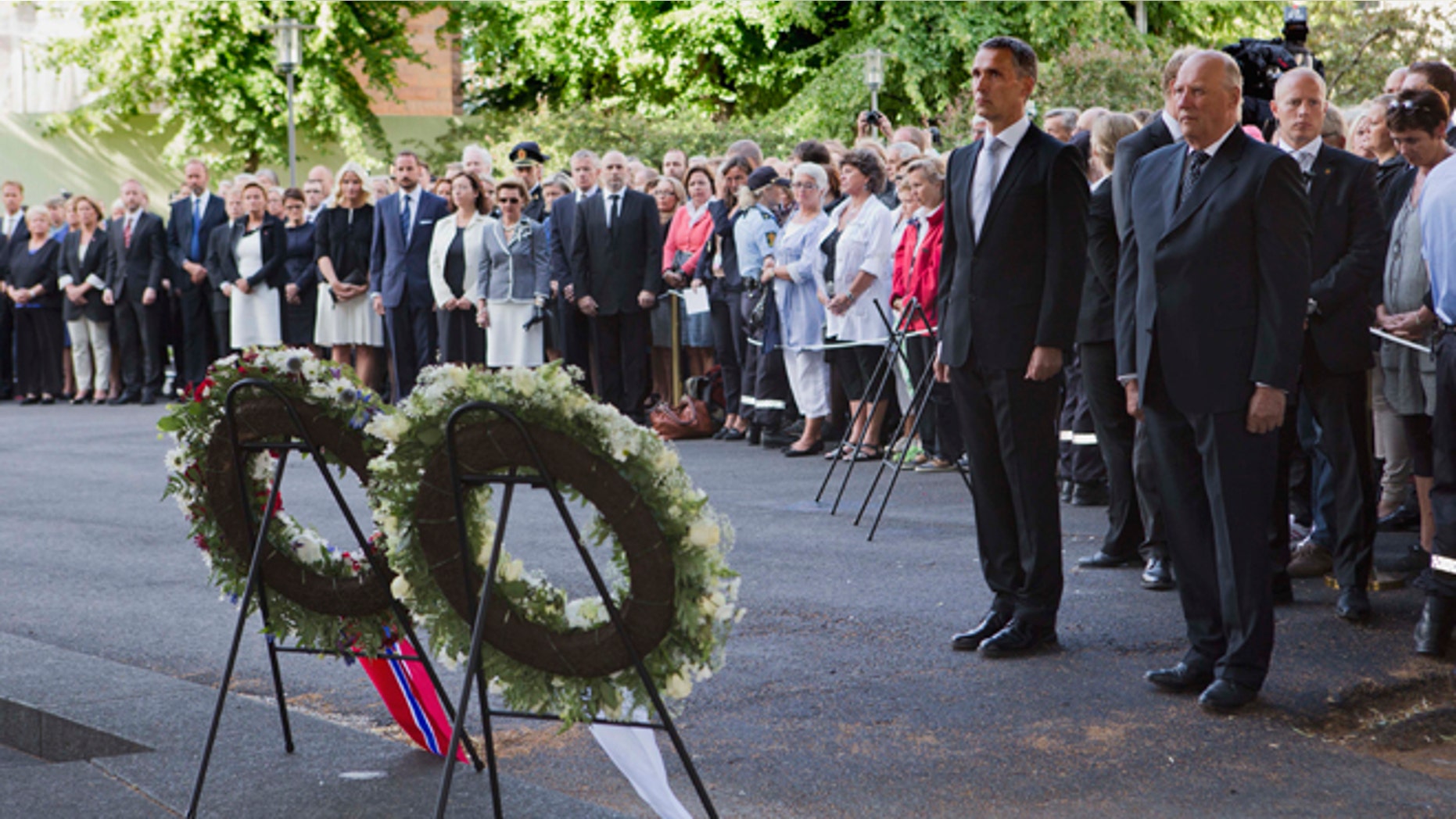 July 22, 2012: Norwegian King Harald, right, and Norwegian Prime Minister Jens Stoltenberg stand together during a wreath laying ceremony to mark the first anniversary of the bomb and shooting tragedy in Oslo and on the Utoeya Island, near the heavily damaged government office building in Oslo.
