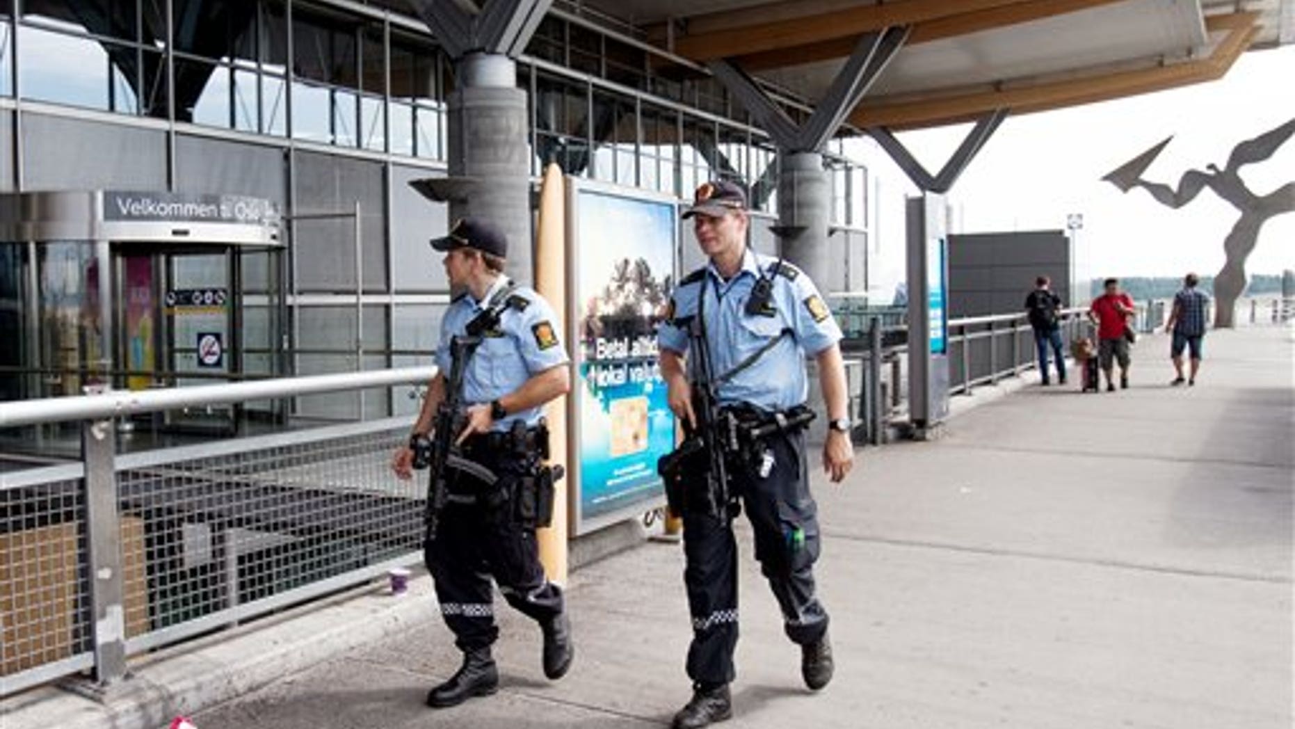 July 24: Armed Police patrol outside the terminal building at Oslo Airport. Norway's intelligence service says it has been warned of an imminent "concrete threat" against the nation from people with links to Islamic fighters in Syria.