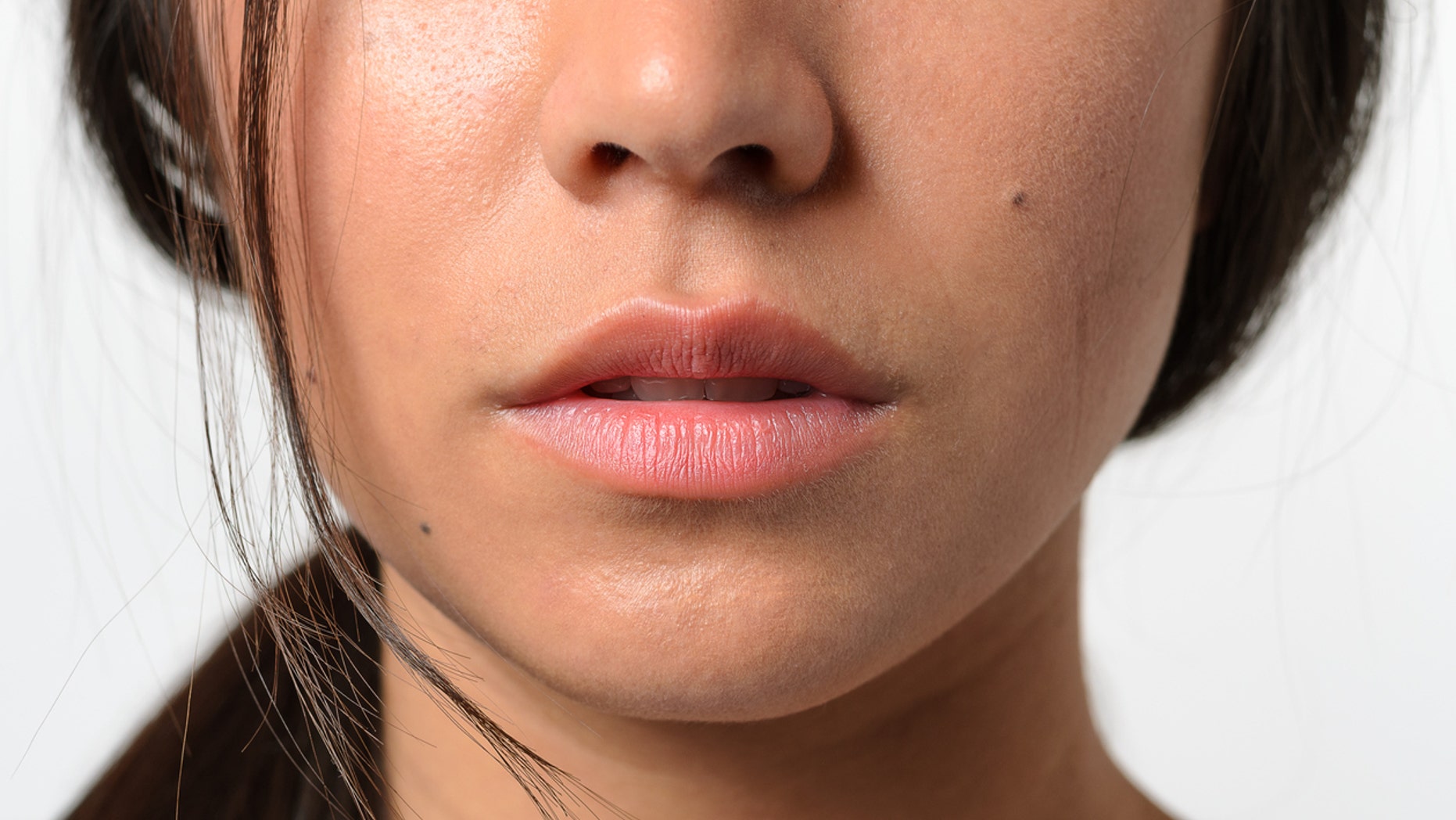 Close up Bare Lips and Nose of a Young Woman