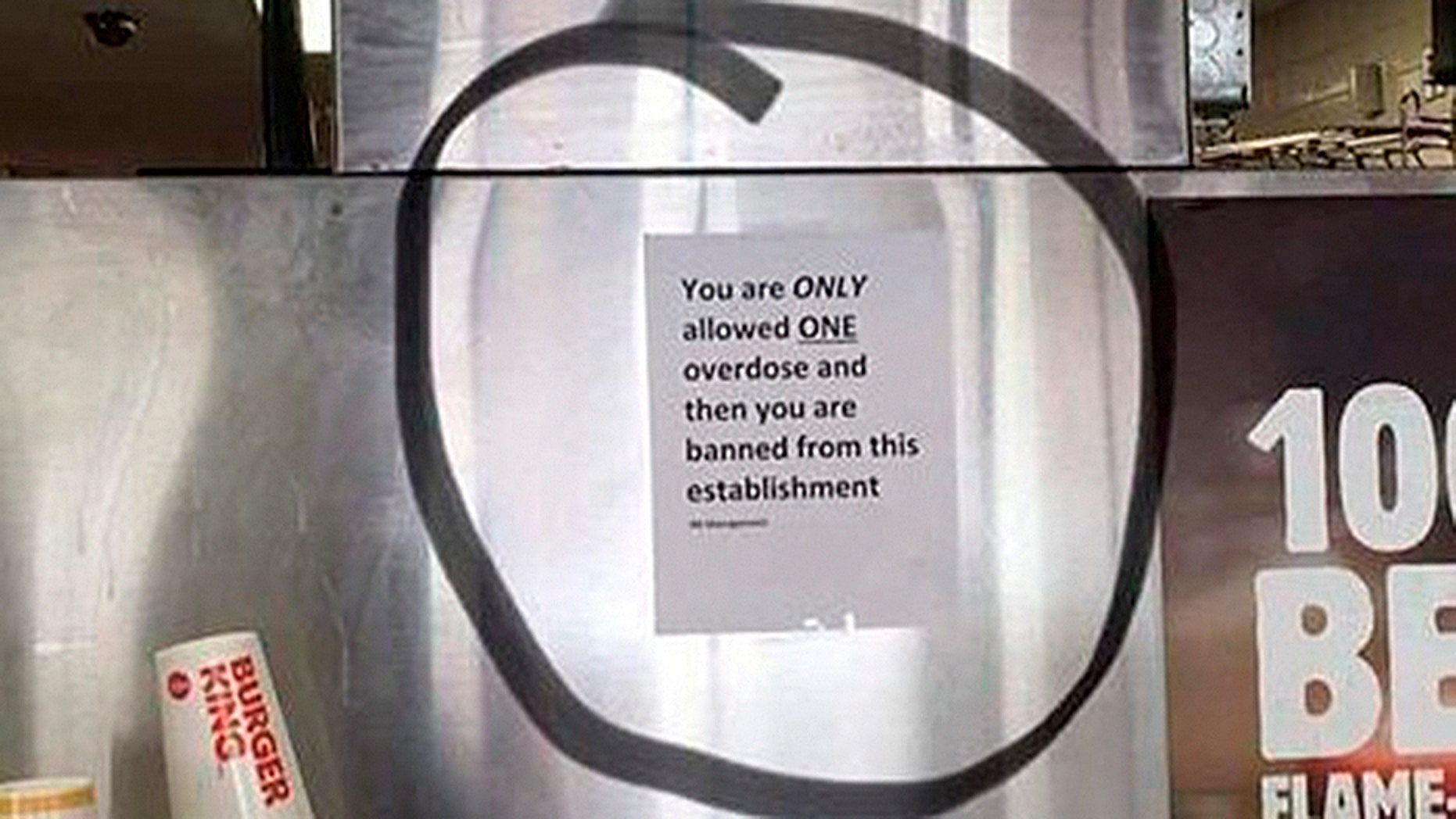 A Burger King in Worcester, Mass. has removed a sign about overdosing that was hanging behind the counter.