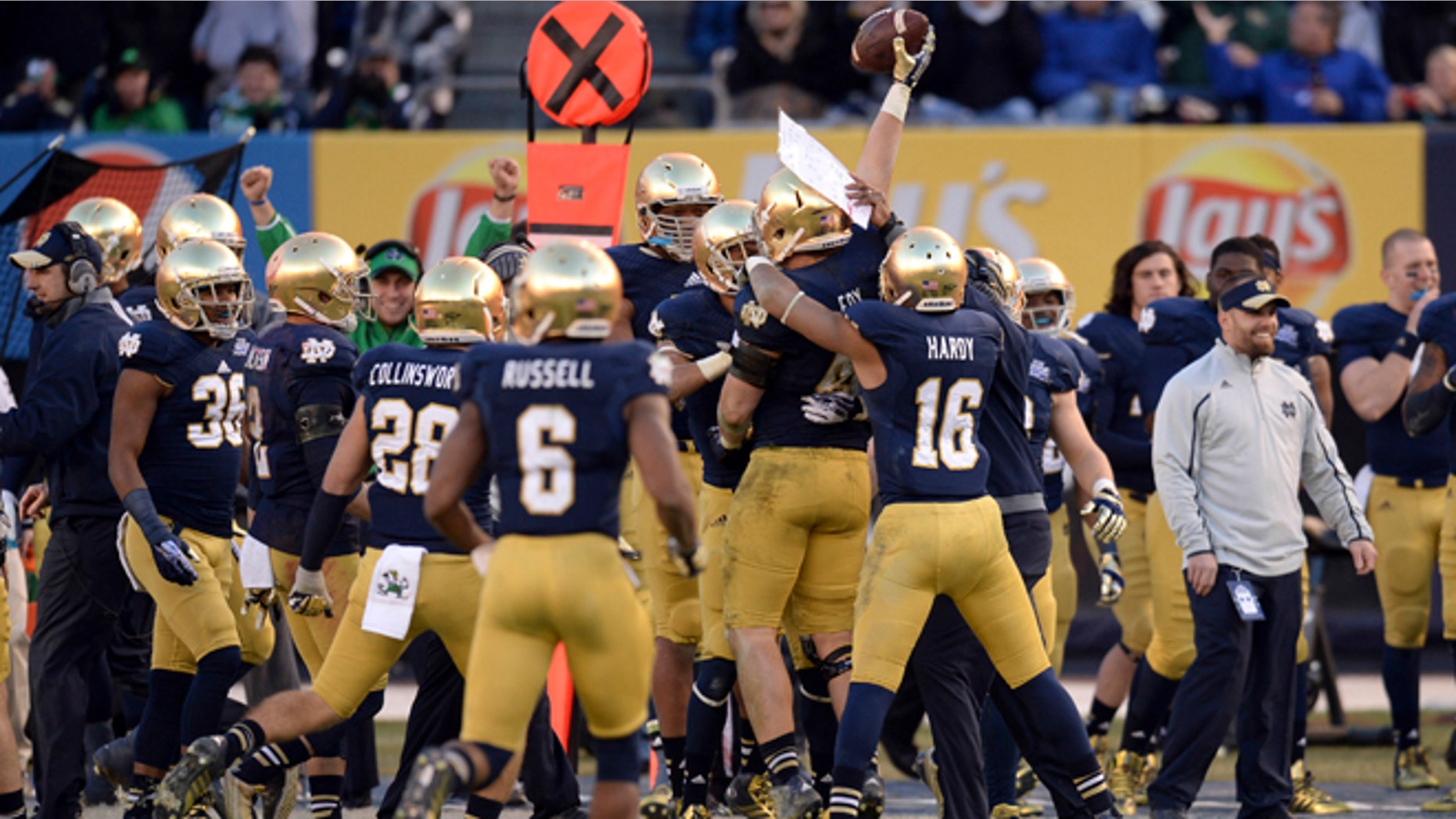 Dec 28, 2013: Notre Dame Fighting Irish linebacker Dan Fox (48) celebrates an interception against the Rutgers Scarlet Knights during the second half of the Pinstripe Bowl at Yankees Stadium. (Reuters)