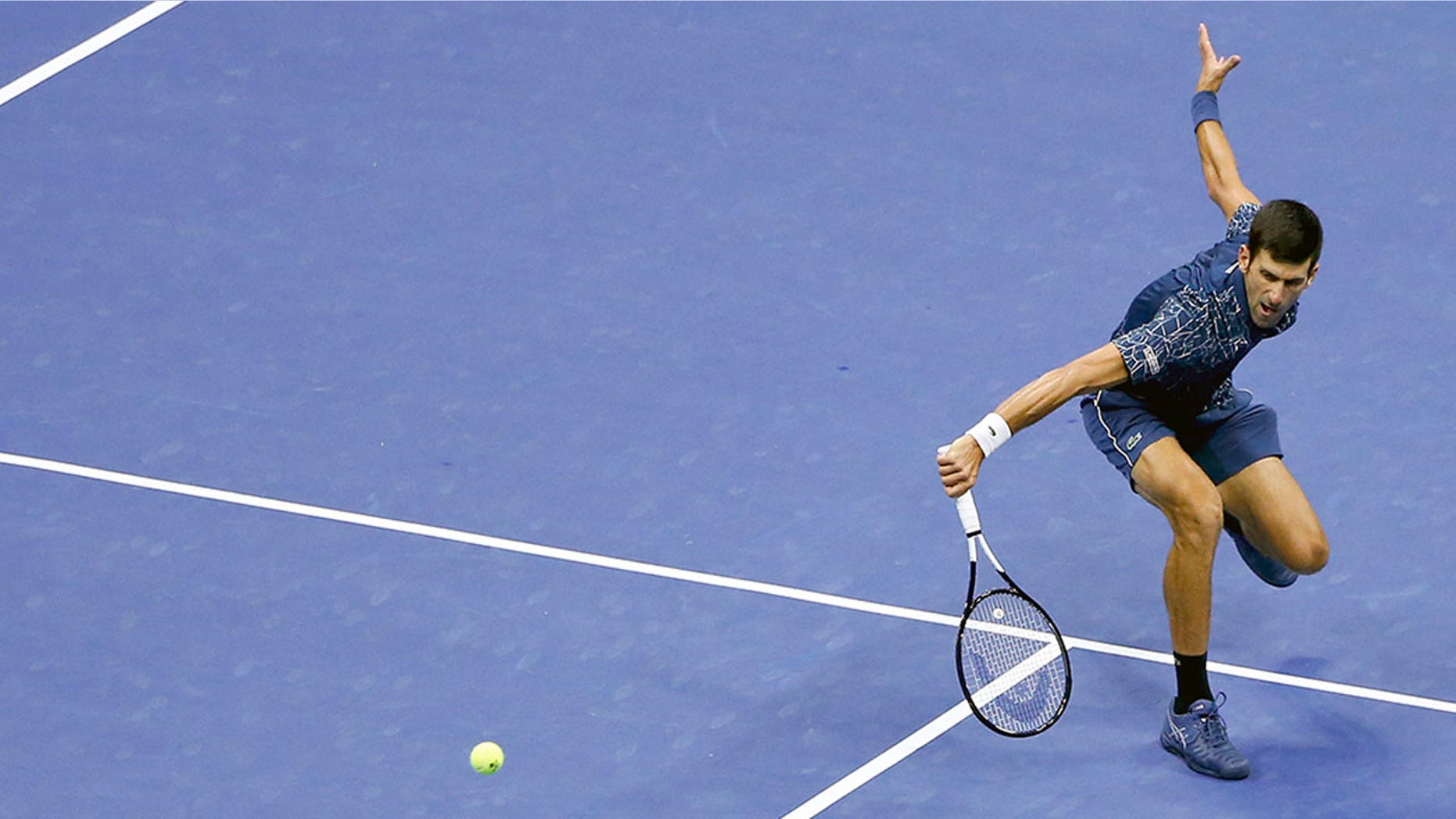 Novak Djokovic, of Serbia, returns a shot to Juan Martin del Potro, of Argentina, during the men's final of the U.S. Open tennis tournament, Sunday, Sept. 9, 2018, in New York. (AP Photo/Jason DeCrow)