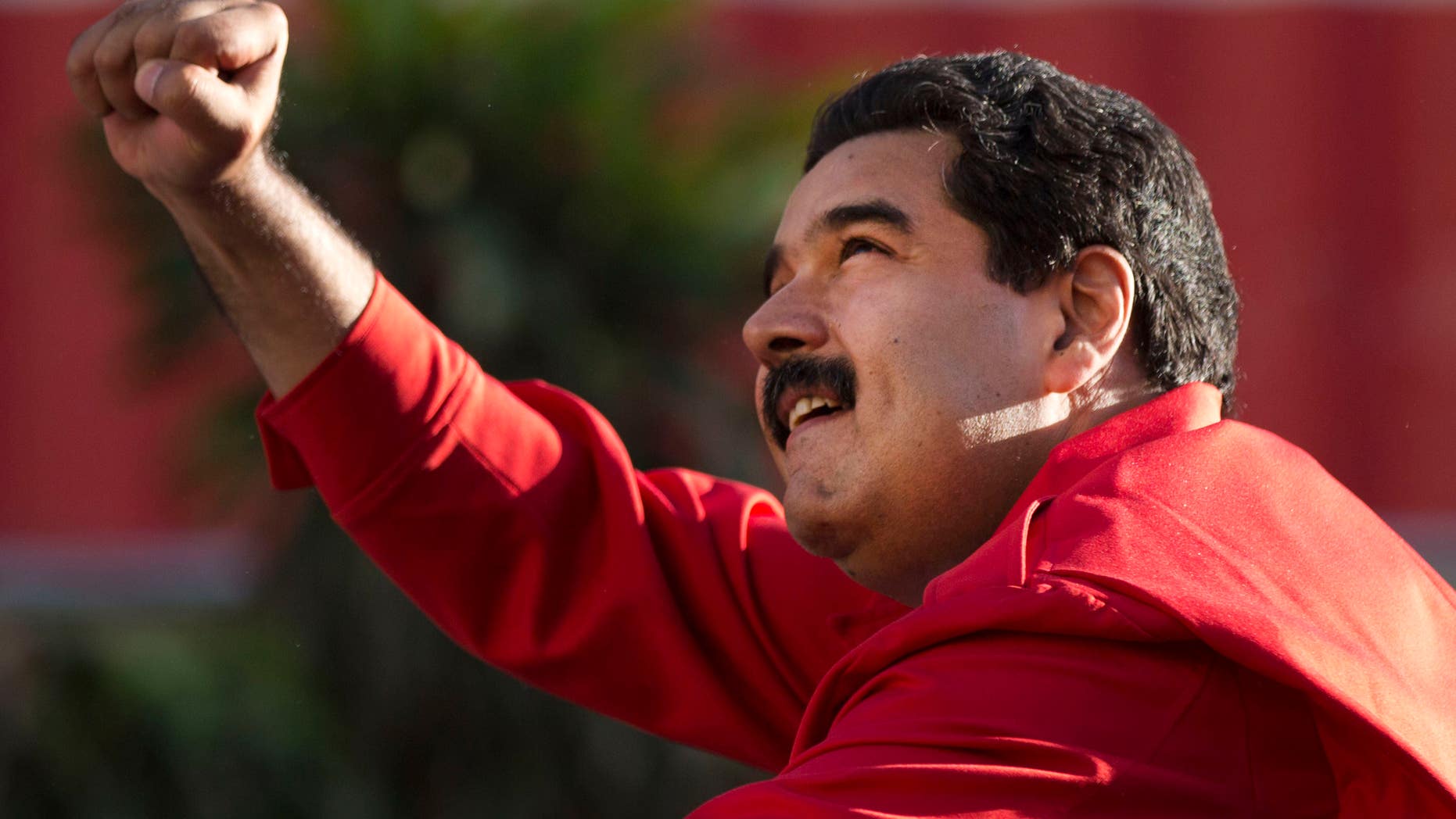 President Maduro gestures to supporters on Dec. 1, 2015, in the popular neighborhood of Petare, in Caracas.