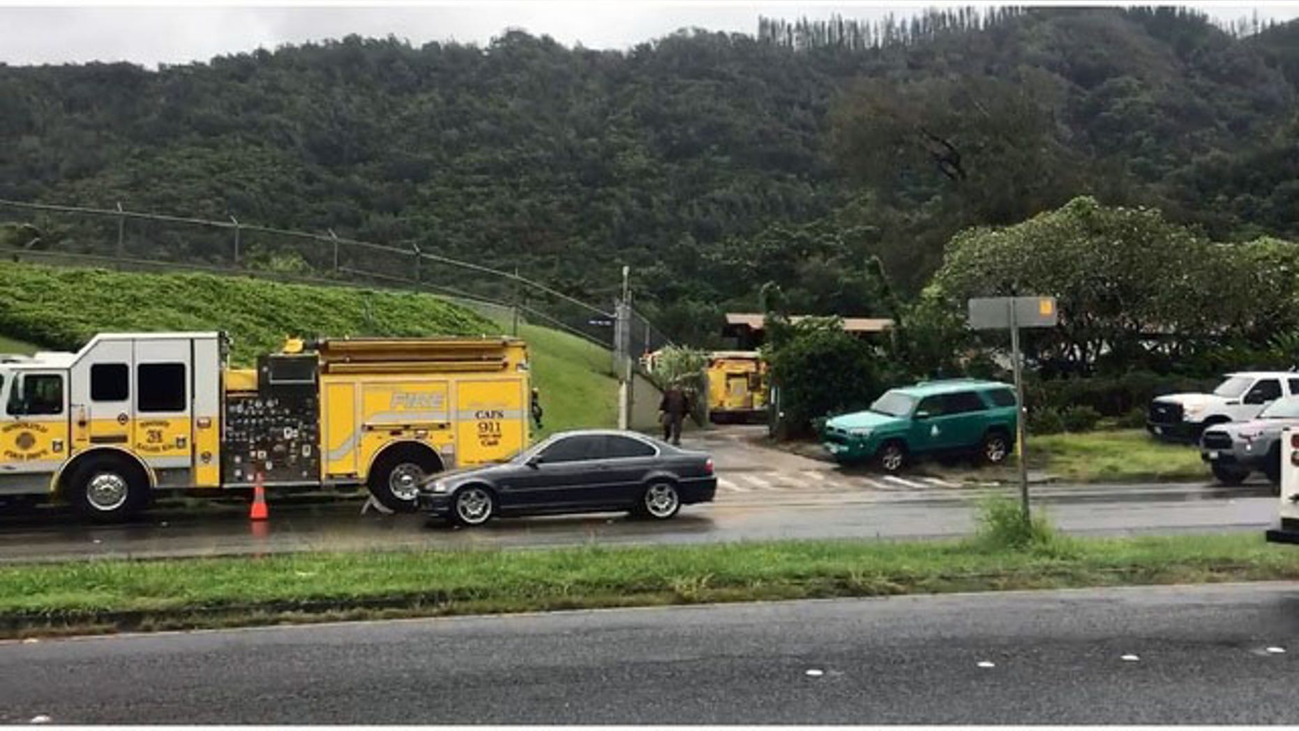 Emergency crews gather near the Nuuanu Reservoir in Oahu, Hawaii.