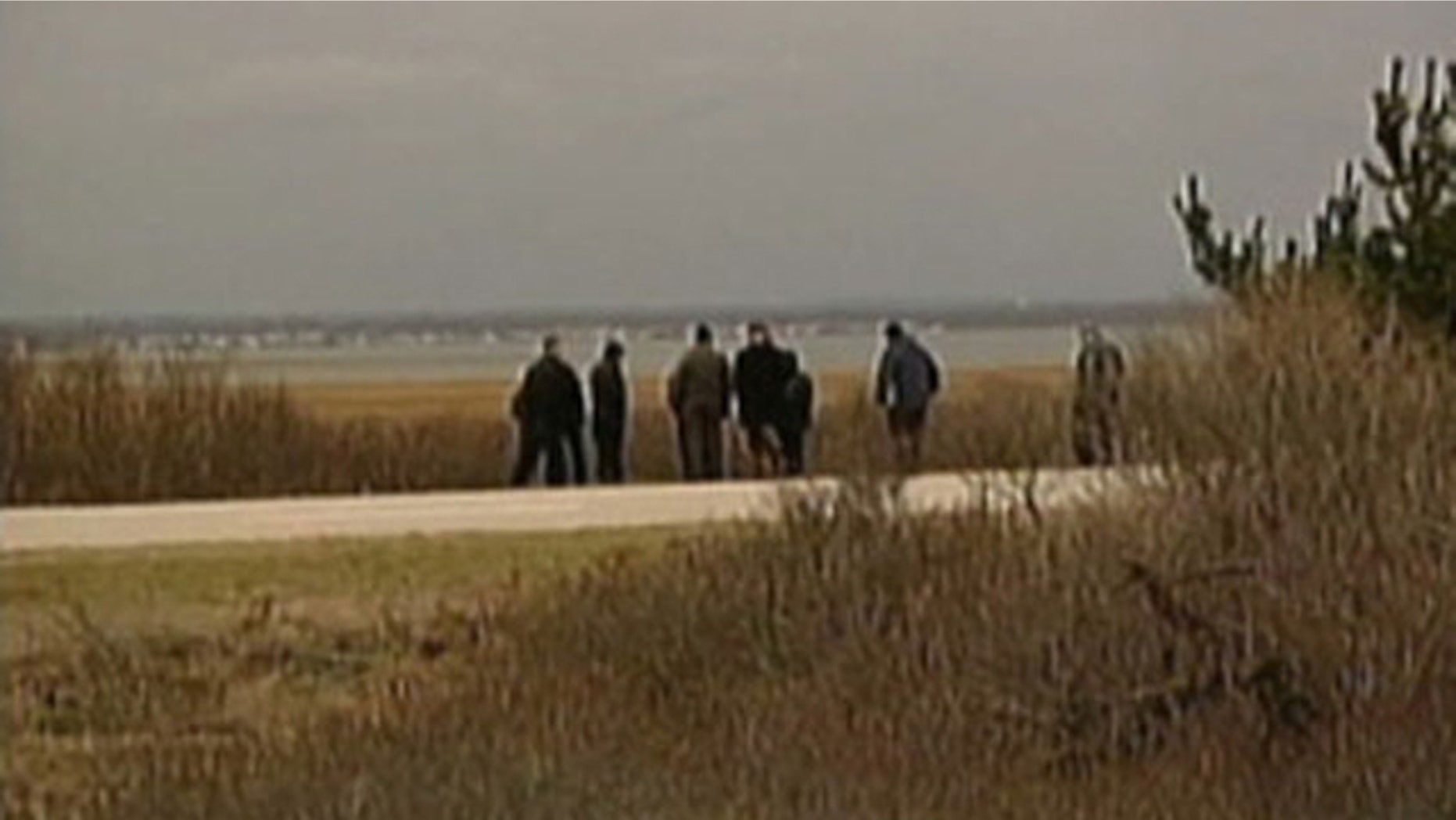 Suffolk County police search a deserted beach on New York's Long Island after finding finding the remains of four people (MyFoxNY.com)