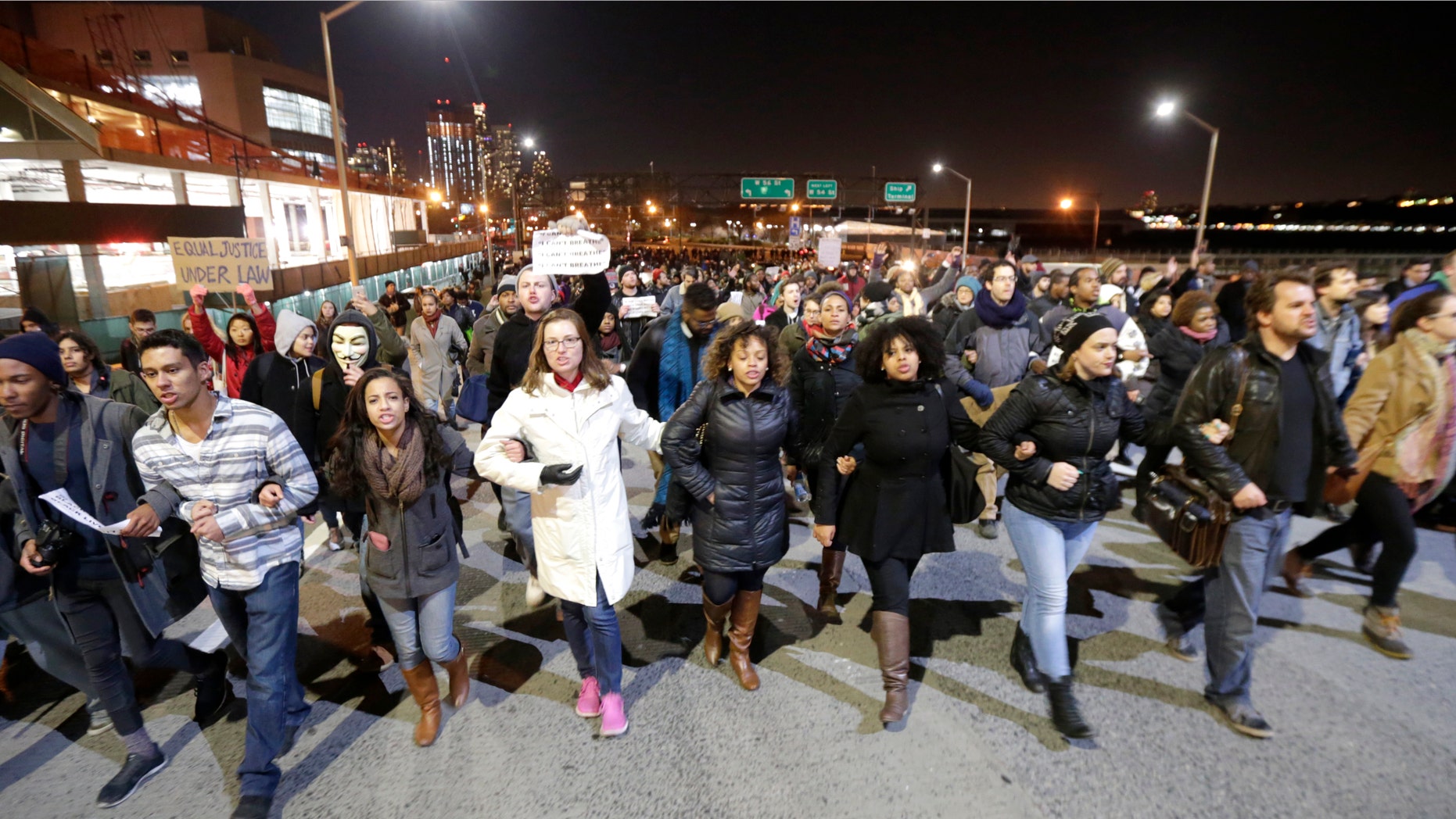 Dec. 3, 2014: eople march in protest on the West Side Highway after it was announced that the New York City police officer involved in the death of Eric Garner was not indicted