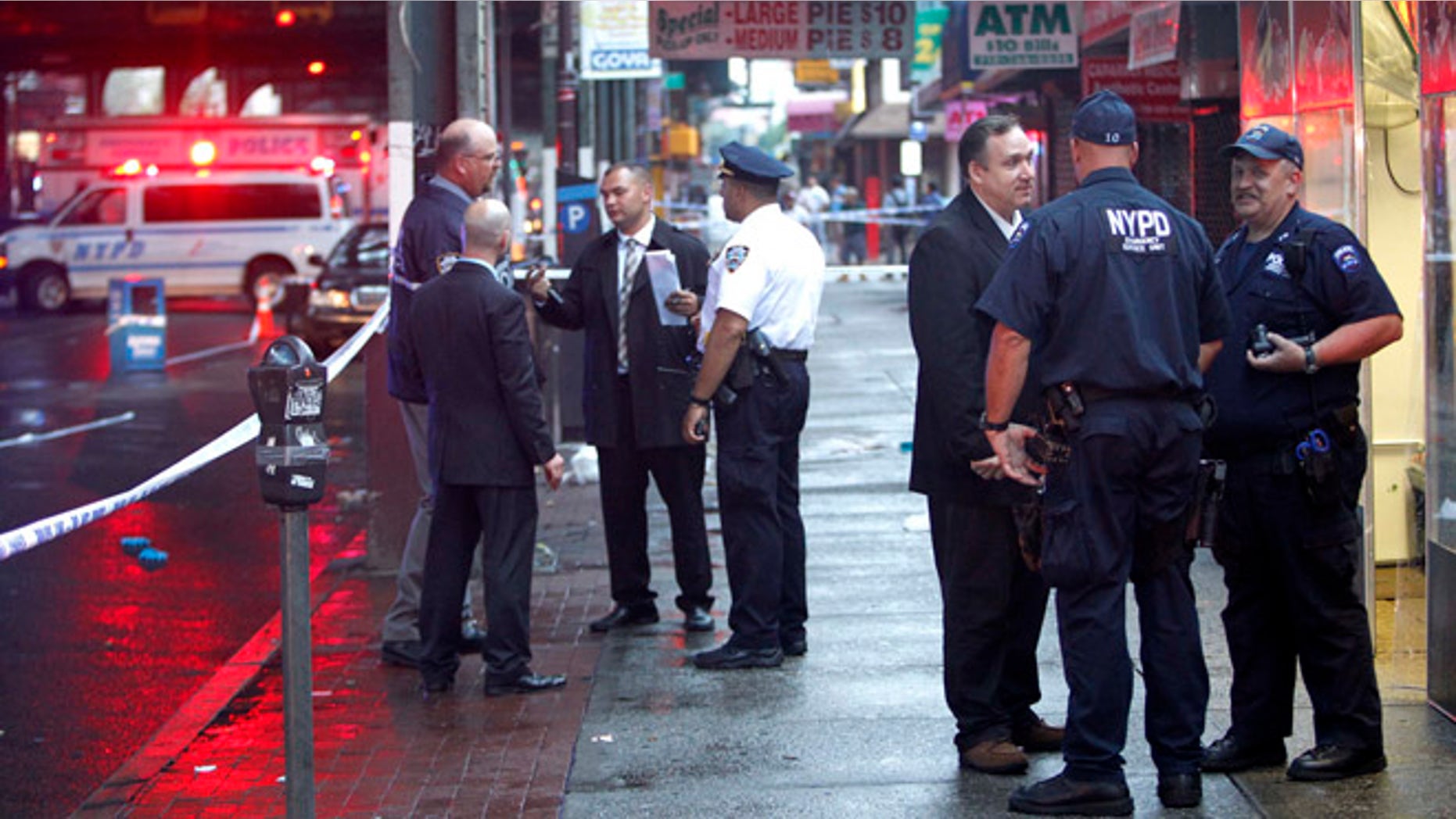 New York police officers inspect a scene in Queens where two people were attacked by a cab driver, witnesses and police say.