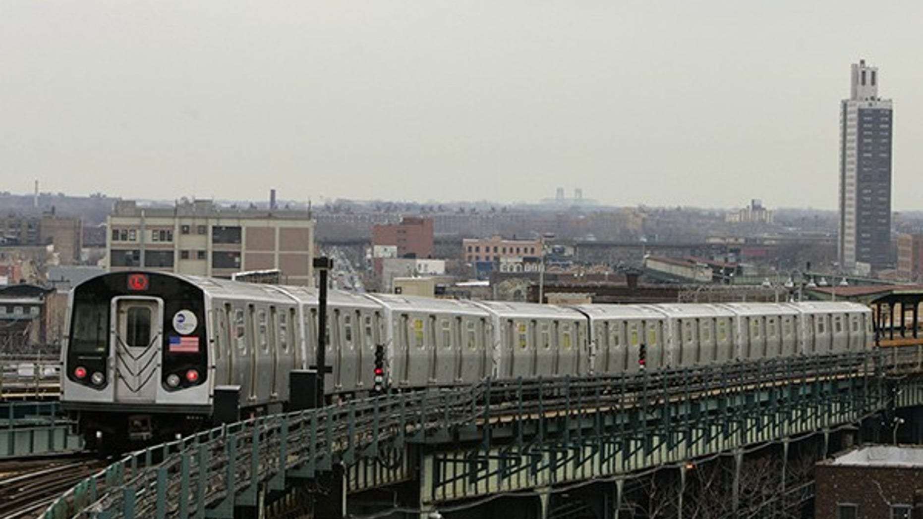 Investigators say a fired cop accused of stabbing his ex-girlfriend jumped in front of a New York City subway train. (AP Photo/ Julie Jacobson)