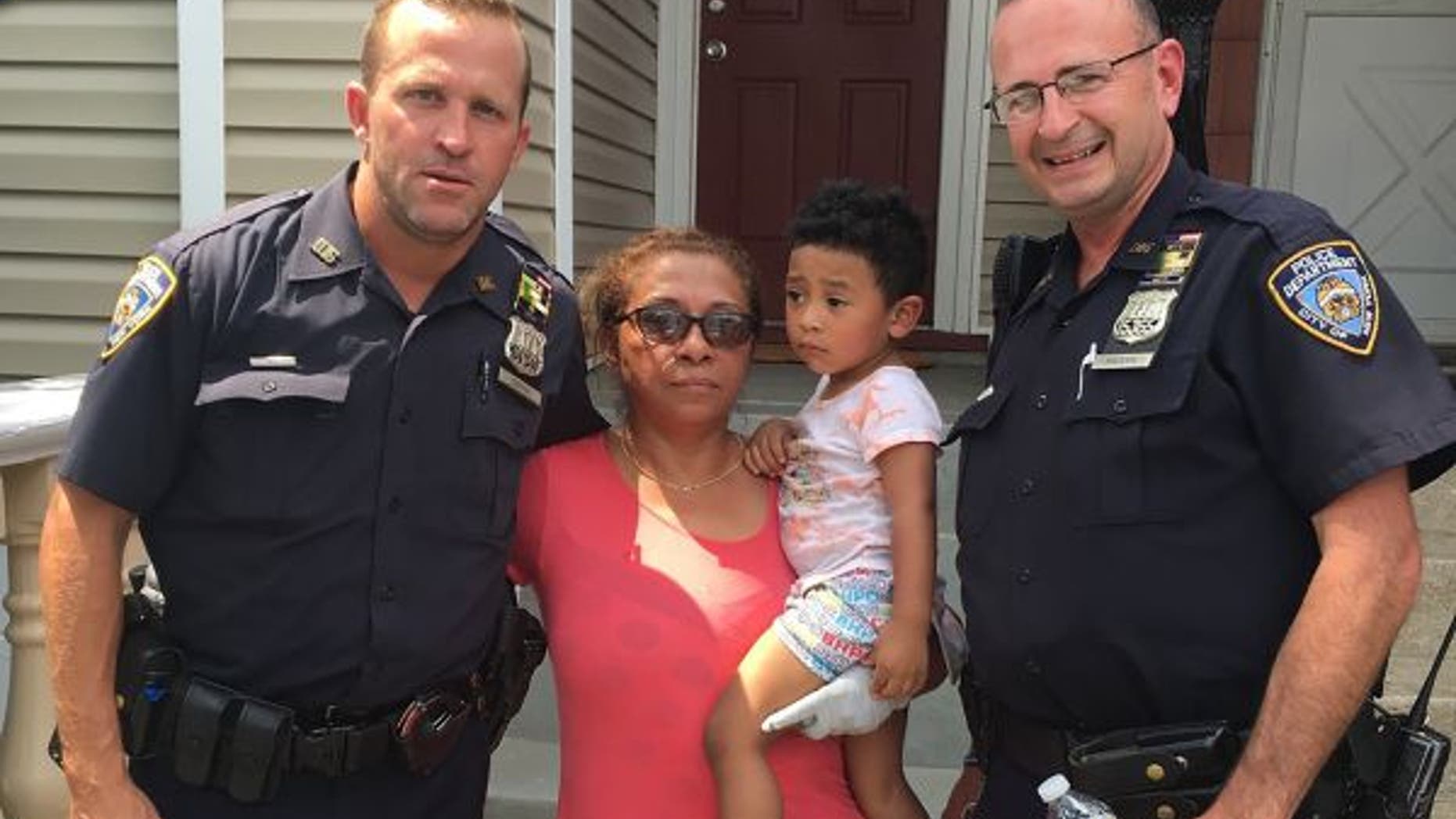 Brian Coffey, left, and John Maderik saved the woman and her 2-year-old grandson from a fire in their New York City home.