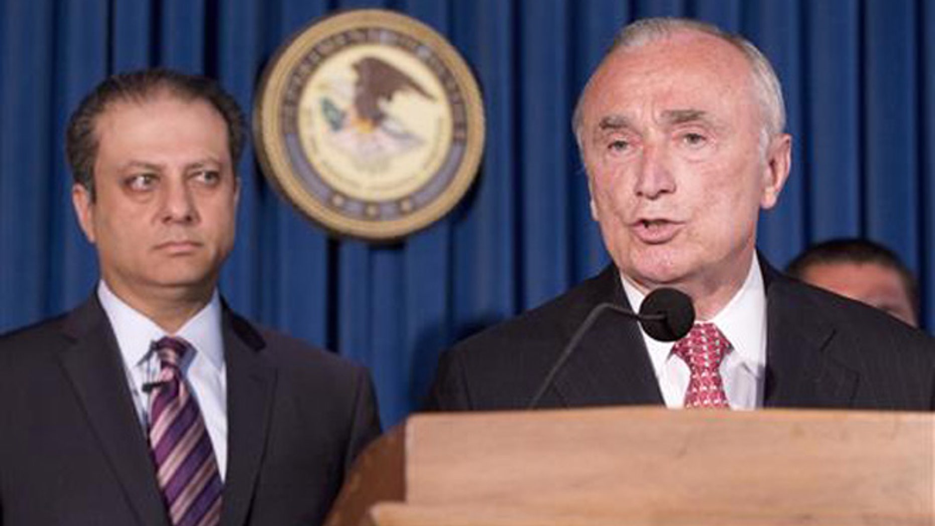 U. S. Attorney Preet Bharara, left, listens as New York City Police Commissioner William Bratton discusses the arrest of four people in connection with New York City's ongoing corruption probe, Monday, June 20, 2016, in New York.
